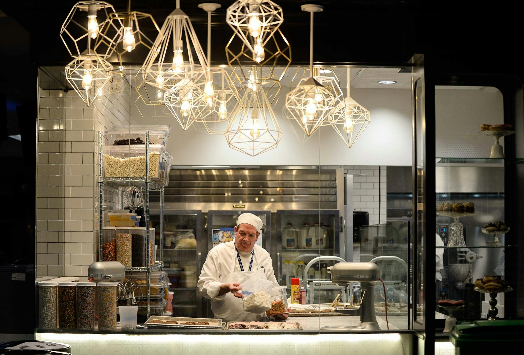 Ken Pervenanzi, a baker with Angel Food Bakery, added frosting and sprinkles to donuts a 2:12 am Friday morning in Terminal 1 at MSP. ] AARON LAVINSKY &#xef; aaron.lavinsky@startribune.com Thursday and Friday are among the busiest days of the holiday travel season at the Minneapolis-St. Paul International Airport. MSP is a 24/7 city unto itself, but who are its night dwellers? Who shovels the tarmac after midnight, bakes the croissants, swabs the toilets and drives the cabs? We interview all, in
