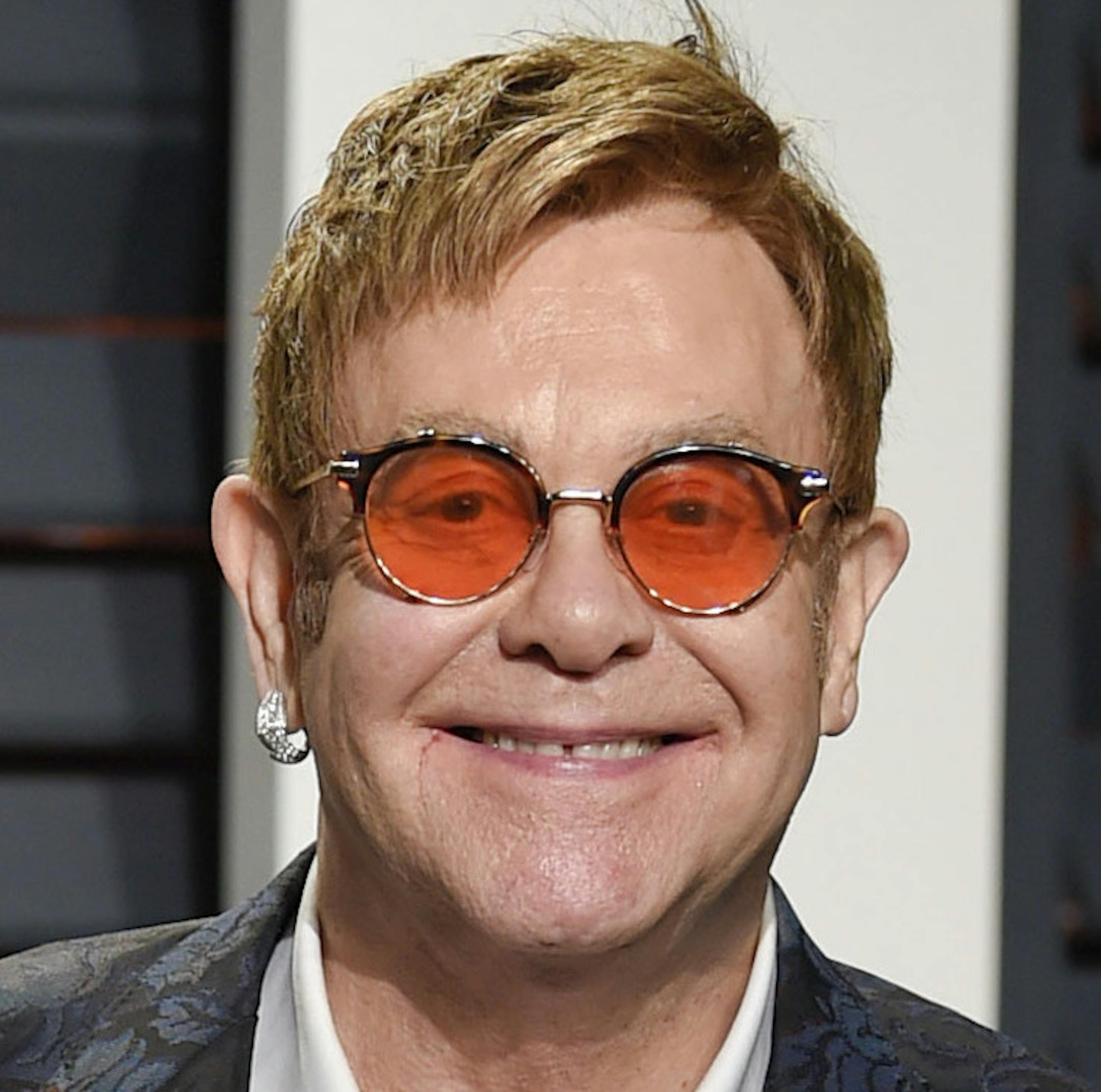 FILE - In this Feb. 27, 2017 file photo, Elton John arrives at the Vanity Fair Oscar Party in Beverly Hills, Calif. Elton John announced Wednesday, Jan. 24, 2018 that his upcoming tour will be his last. (Photo by Evan Agostini/Invision/AP, File)