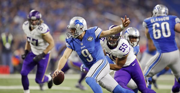 Detroit Lions quarterback Matthew Stafford (9) was pressured by Minnesota Vikings outside linebacker Anthony Barr (55) in the forth quarter at Ford Fi