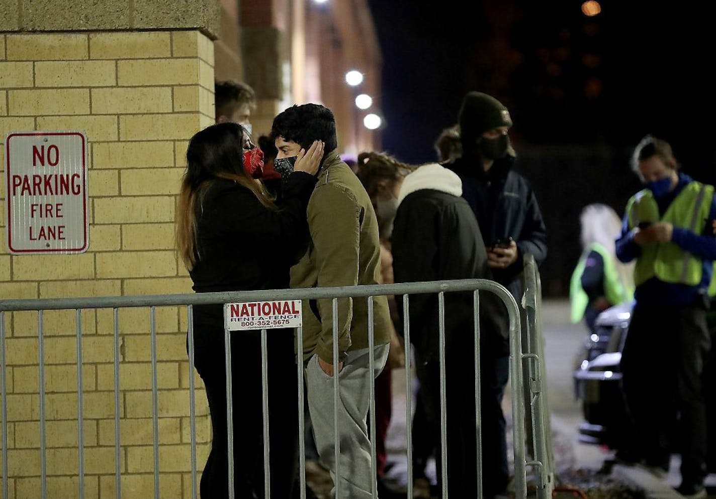 Black Friday shoppers try to stay warm while waiting for the doors to open at Best Buy for the electronics retailer's early 5 a.m. opening Friday in Richfield.