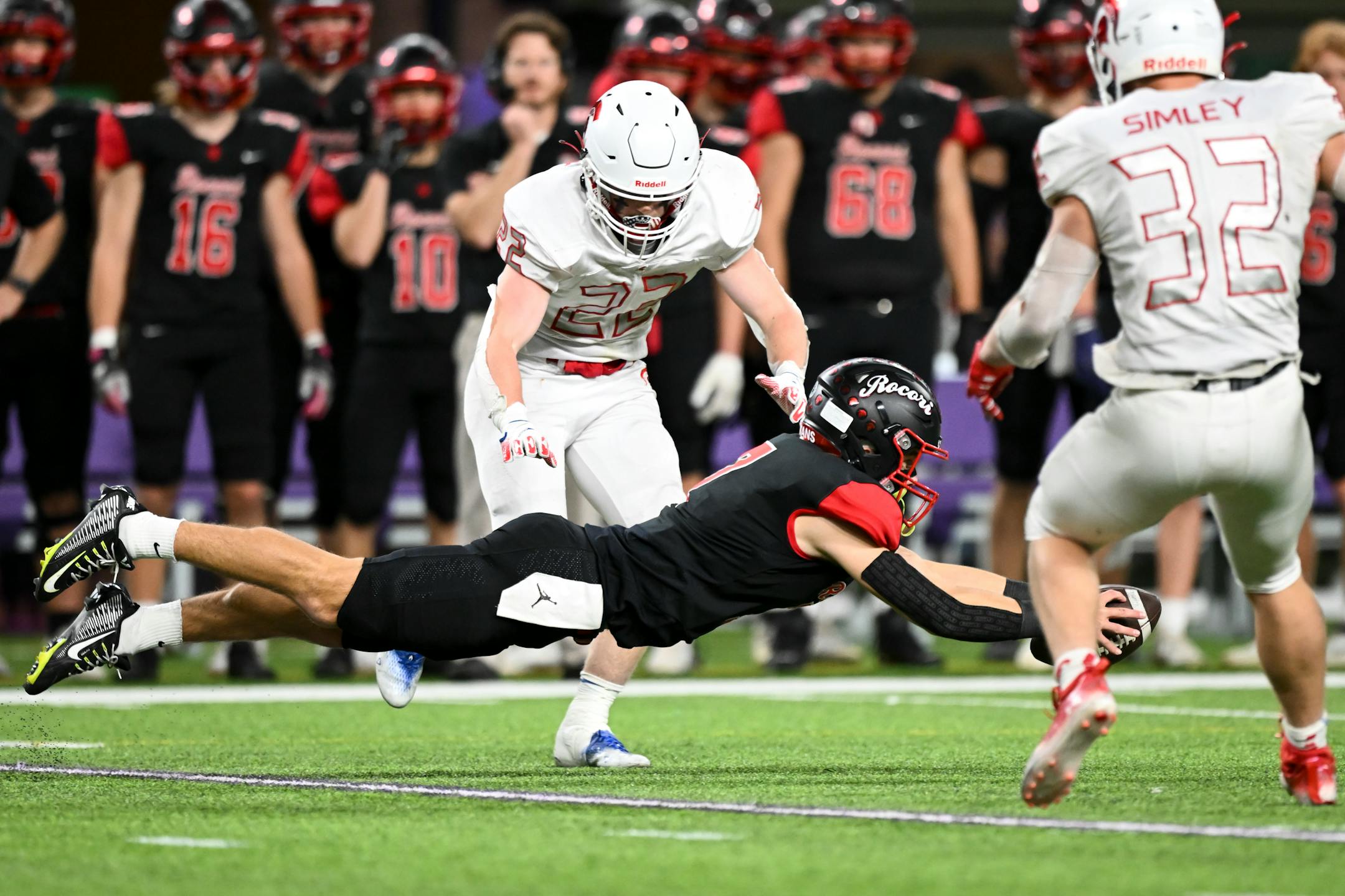 Rocori quarterback Jack Spanier (7) dives for an extra yard and a first down during the second half.