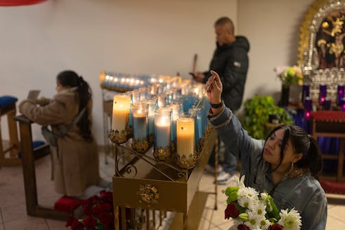 Many congregants, including&nbsp;Maribel Rangel, and devotees dropped to their knees to pray and light candles to pay reverence to the Virgin of Guadalupe.