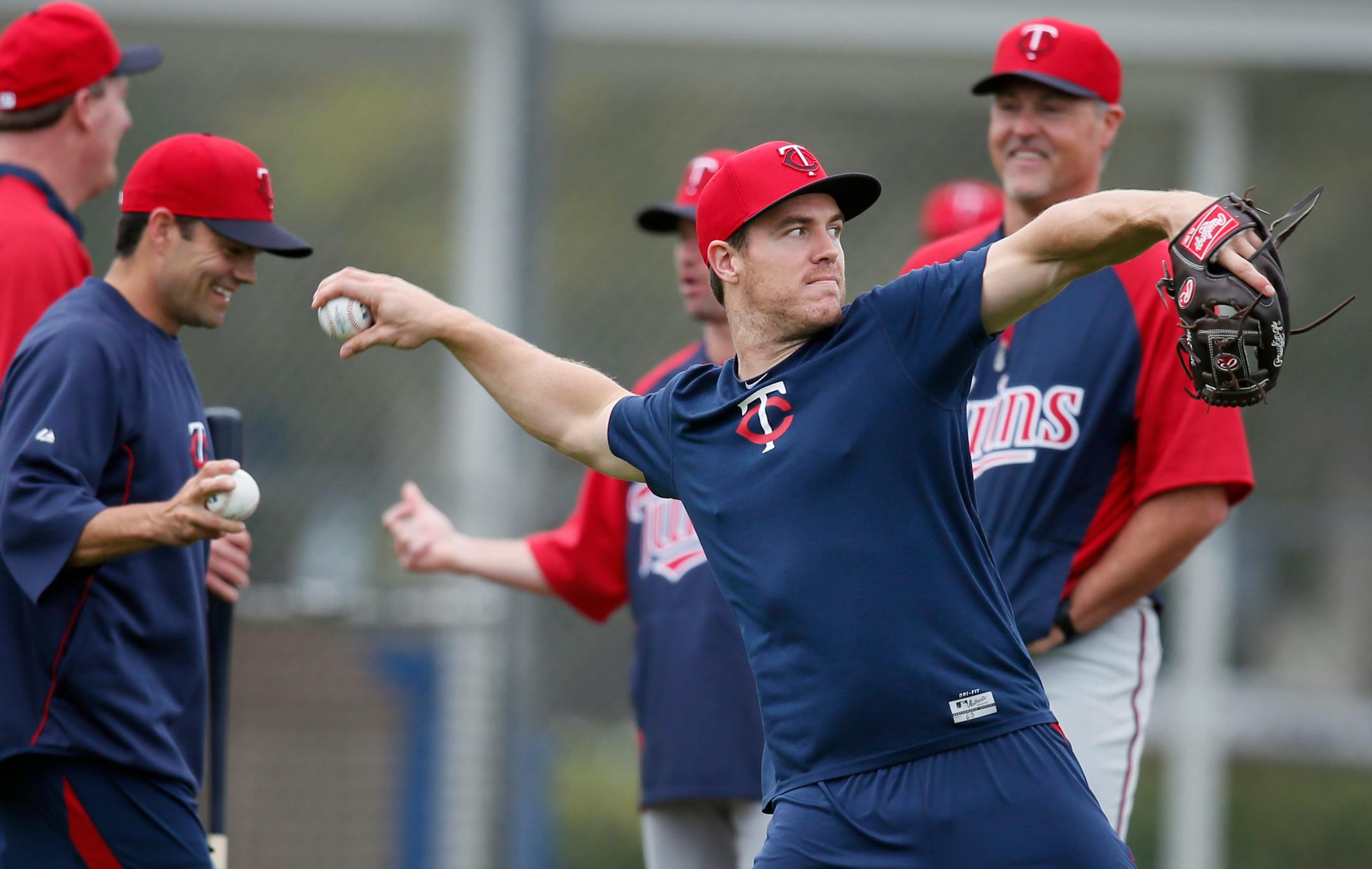 Twins outfielder Joe Benson warmed up during spring training in 2013. He was waived by the club later that season, and is back with another shot this spring.