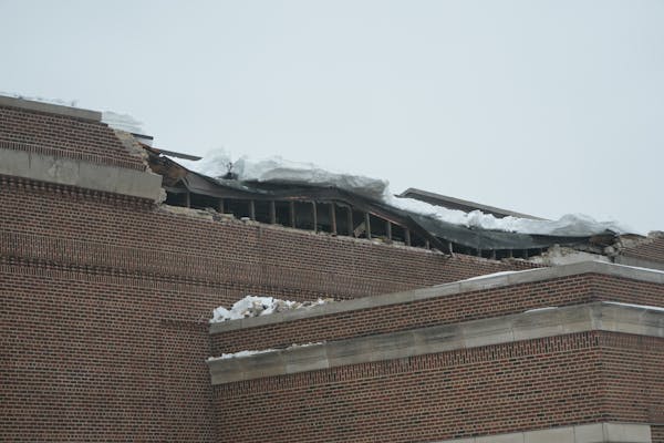 Northrop auditorium on the University of Minnesota campus is closed as crews and engineers examine a partial roof collapse on Thursday.