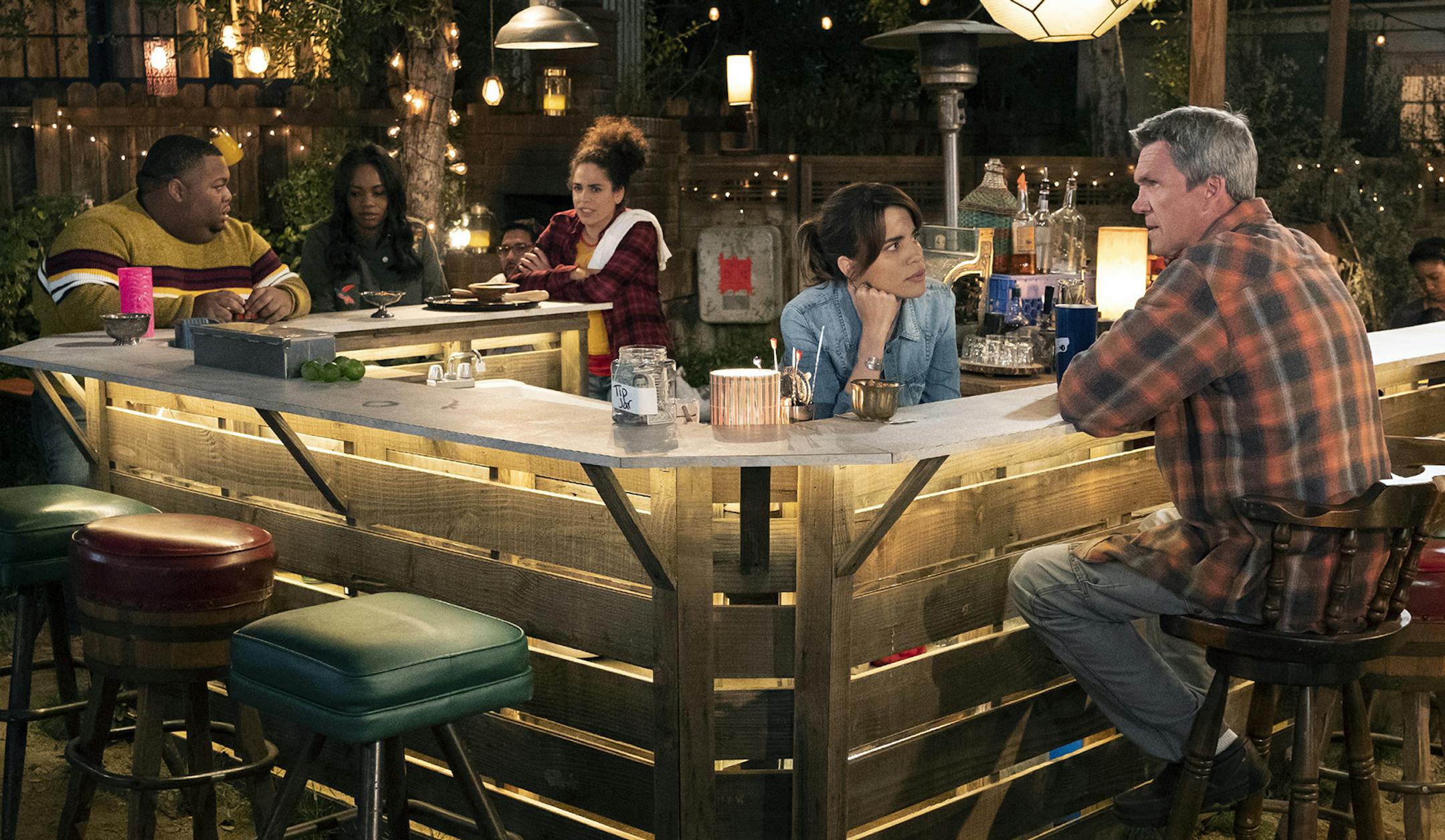 Natalie Morales, second from right, plays the title character in "Abby's." The cast also includes Neil Flynn, right. JUSTIN LUBIN • NBC