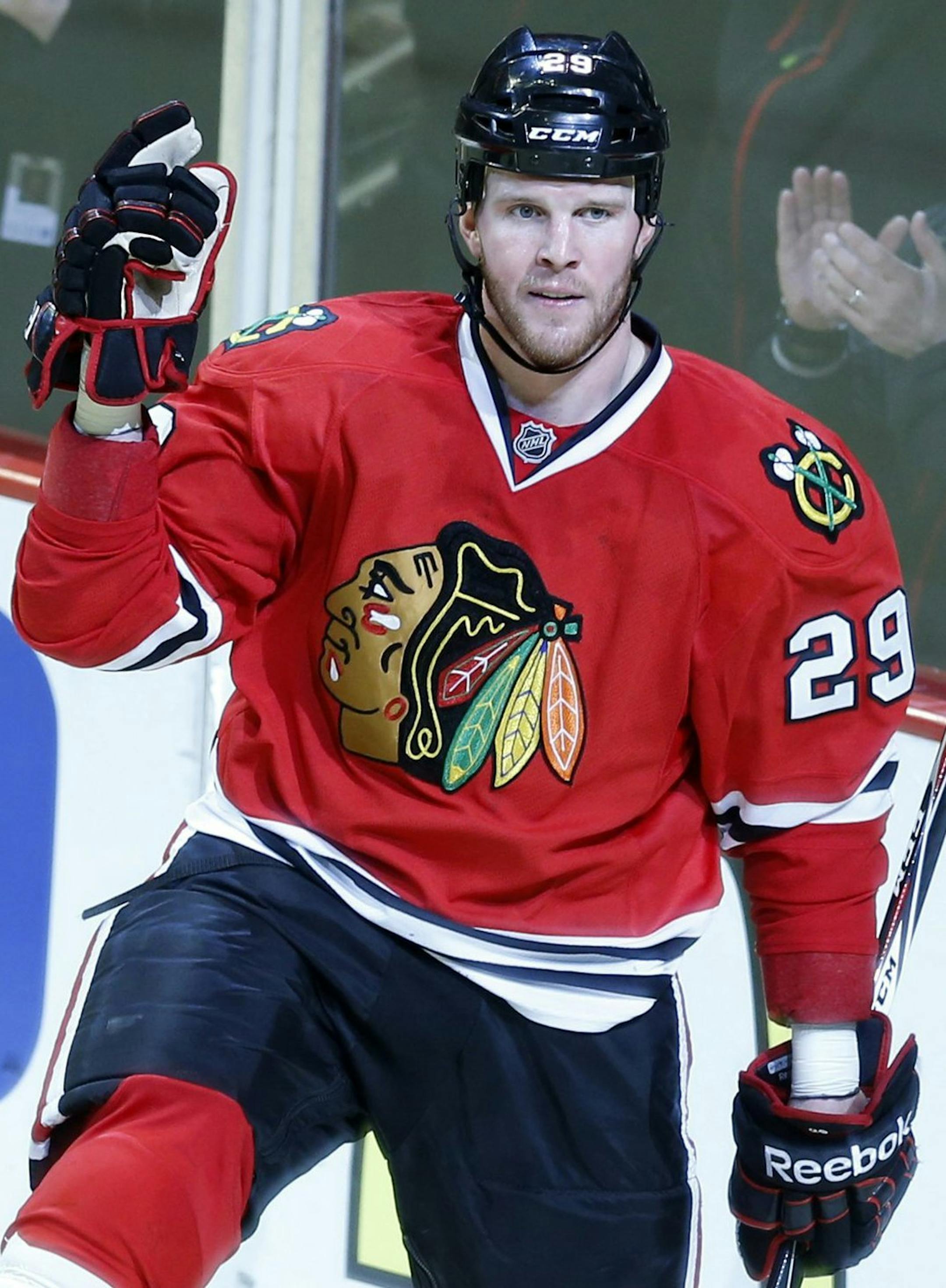 Chicago Blackhawks' Bryan Bickell celebrates his 3rd-period goal as Minnesota Wild's Jason Pominville skates away at the United Center on Sunday, May 4, 2014, in Chicago. The Blackhawks defeated the Wild, 4-1, during Game 2 of a Western Conference semifinal. (Scott Strazzante/Chicago Tribune/MCT)