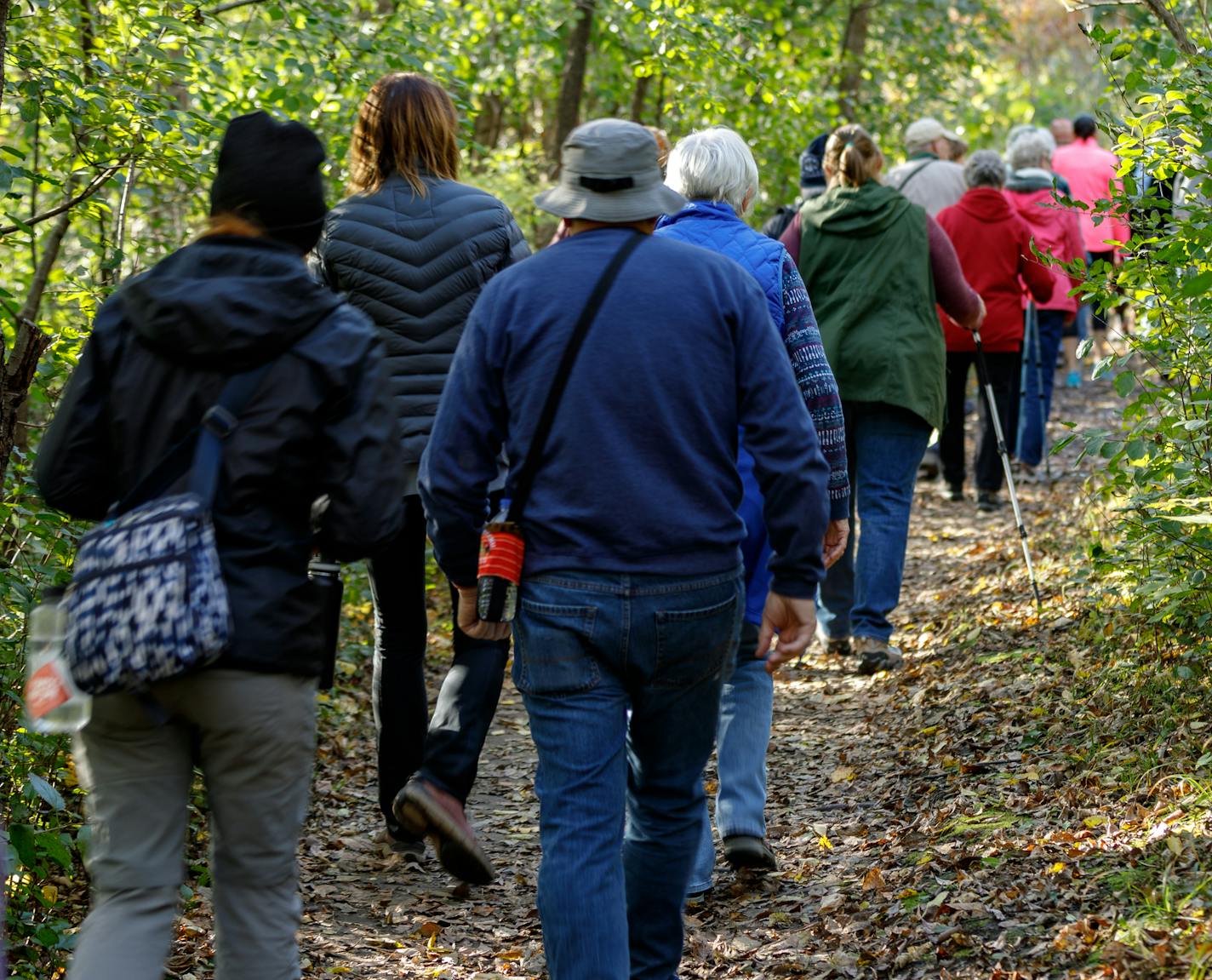 Scores of Red Wing and Prairie Island Indian Community residents came together Tuesday for a walk up Barn Bluff, which the Mdewakanton Dakota people call He Mni Can. The joint gathering was called to explain the significance of the promontory to native peoples and promote understanding after the city formally ended its tolerance of graffiti on the bluff.