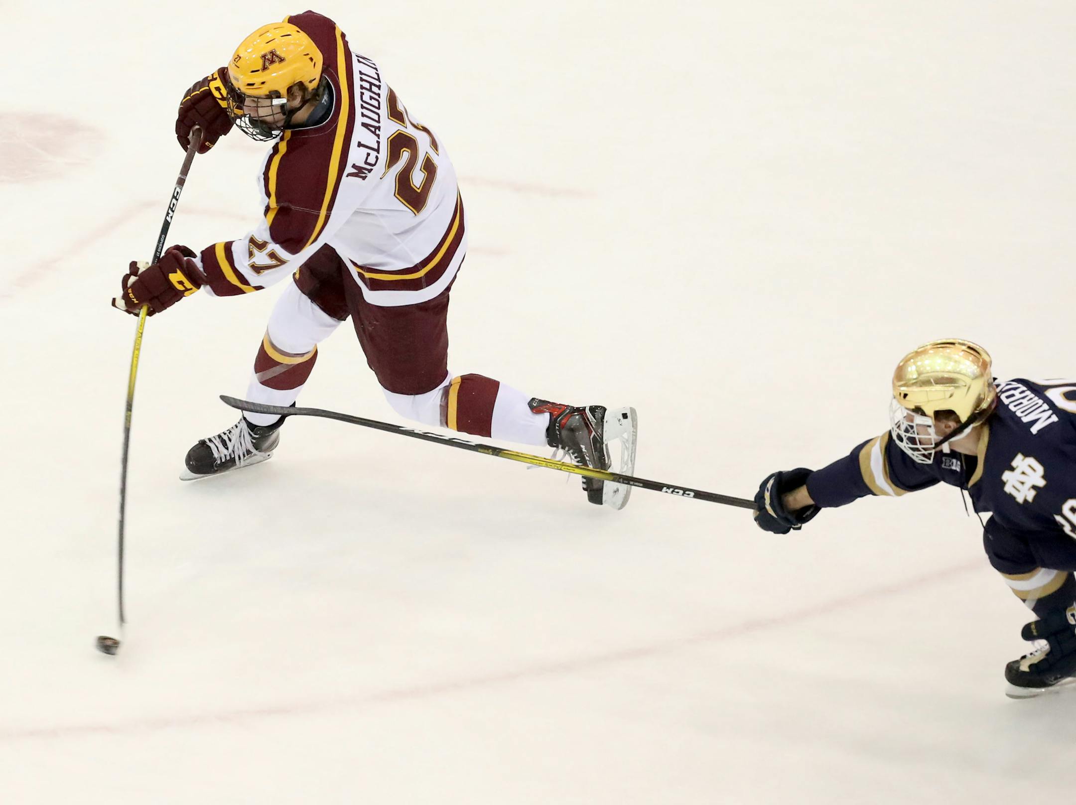 Blake McLaughlin hits a slap shot against Notre Dame during a game in November at Mariucci Arena.