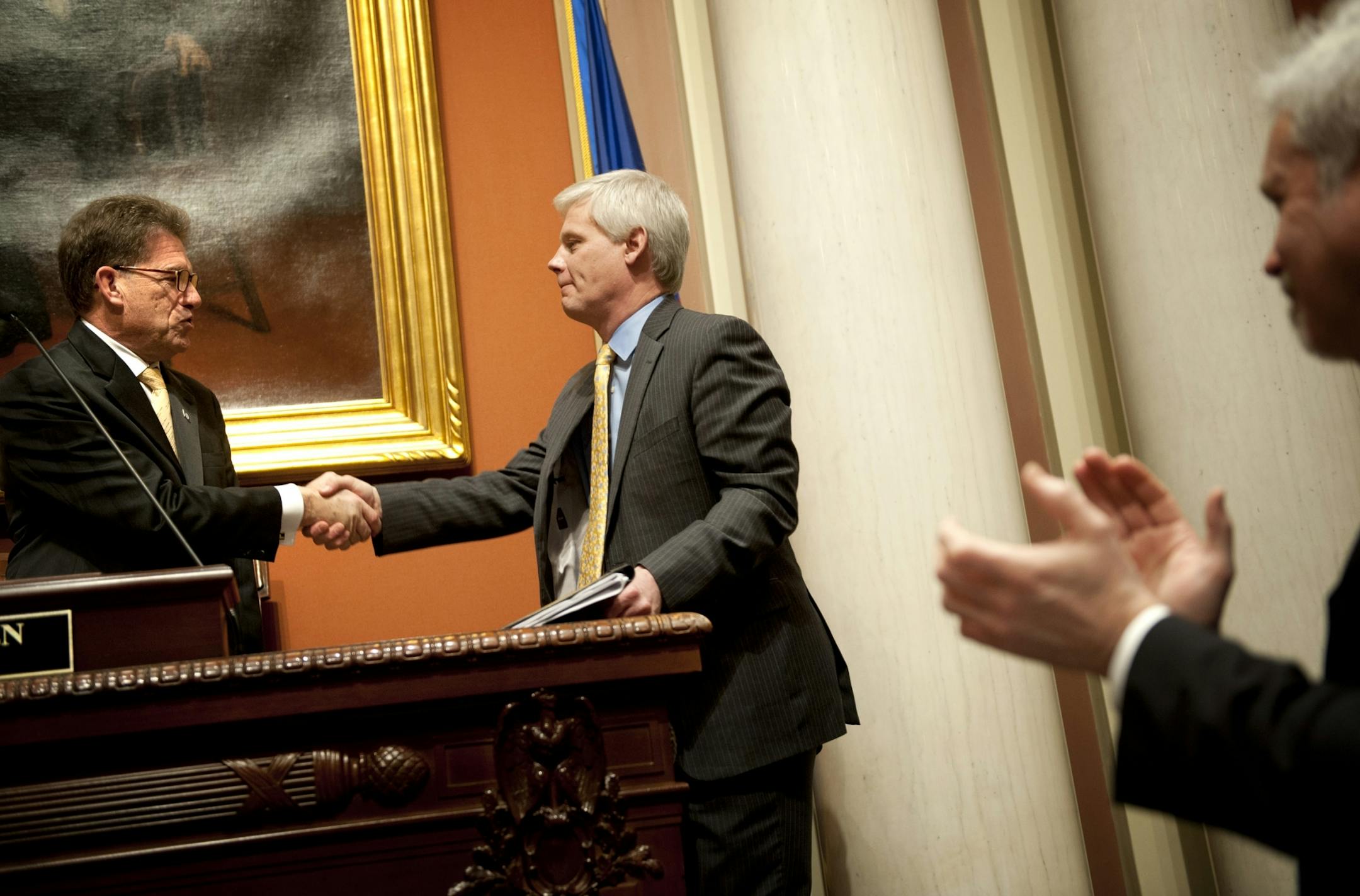 Secretary of State Mark Ritchie, left, greeted new House Speaker Paul Thissen, DFL-Minneapolis, after his election Tuesday.