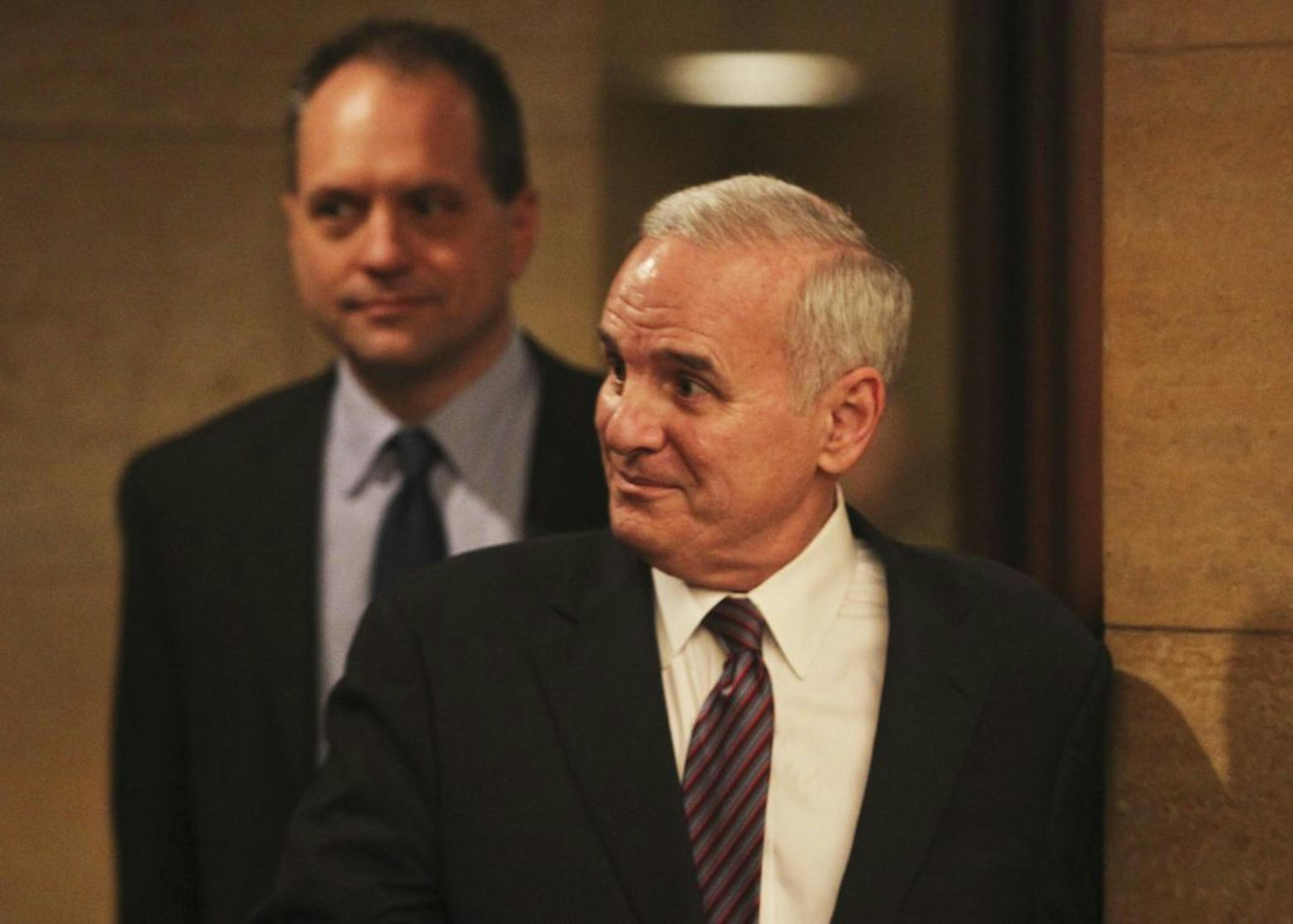 An upbeat Gov. Mark Dayton and state management and budget commissioner Jim Schowalter entered with smiles to announce a budget surplas during a press conference at the Capitol Wednesday, Feb. 29, 2012, in St. Paul, MN.
