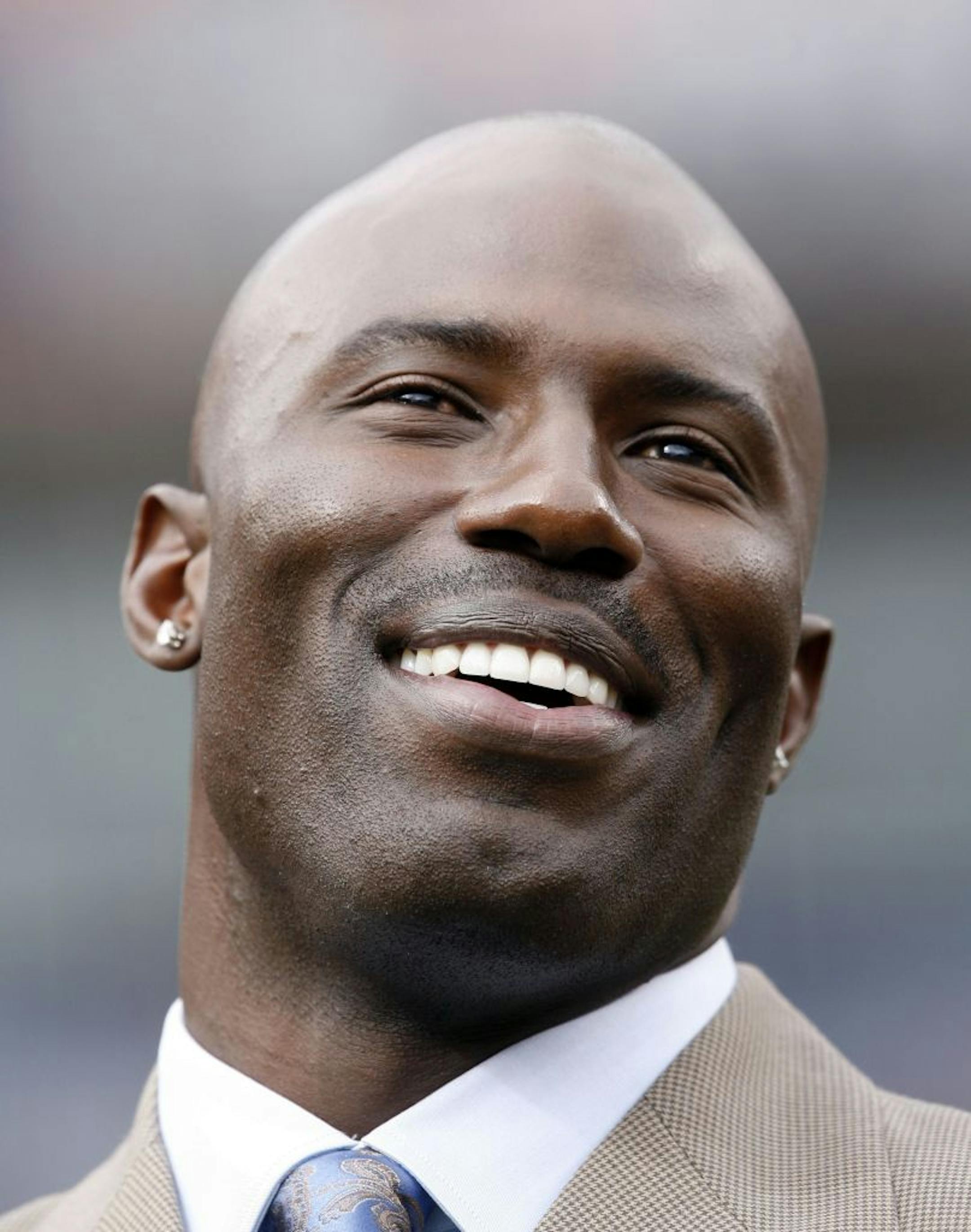 Retired Denver Broncos running back Terrell Davis smiles during a ceremony to induct him into the team's "Ring of Fame" during halftime in the Jacksonville Jaguars' 24-13 victory over the Broncos in a football game in Denver on Sunday, Sept. 23, 2007.