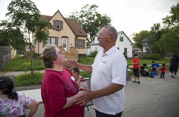 Hennepin County Attorney Mike Freeman spoke with neighbor Chris Billings on the 4000 block of Aldrich Ave. N ] Mark Vancleave - mark.vancleave@startri