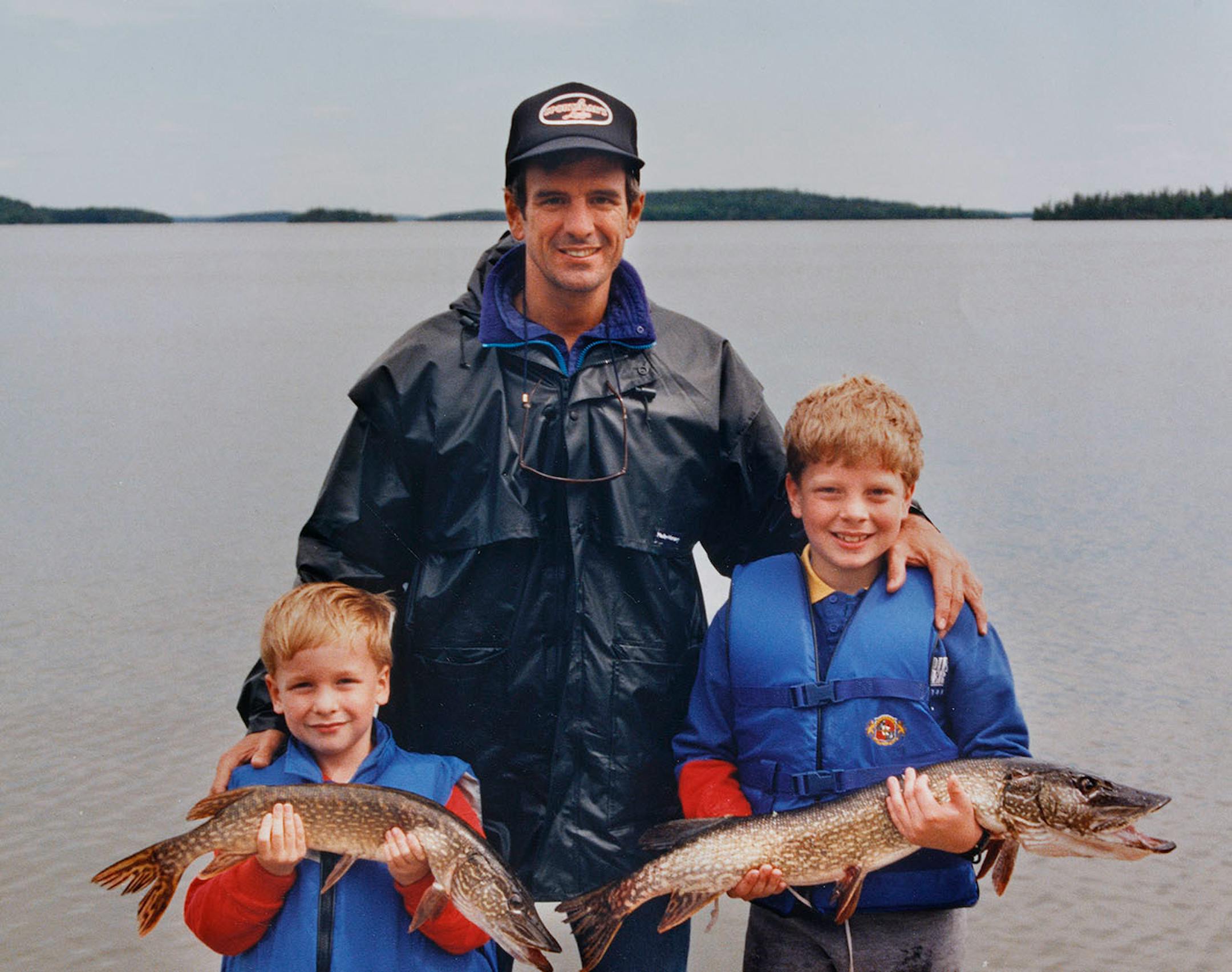 Eric Dayton, fishing with Dad and his younger brother Andrew.