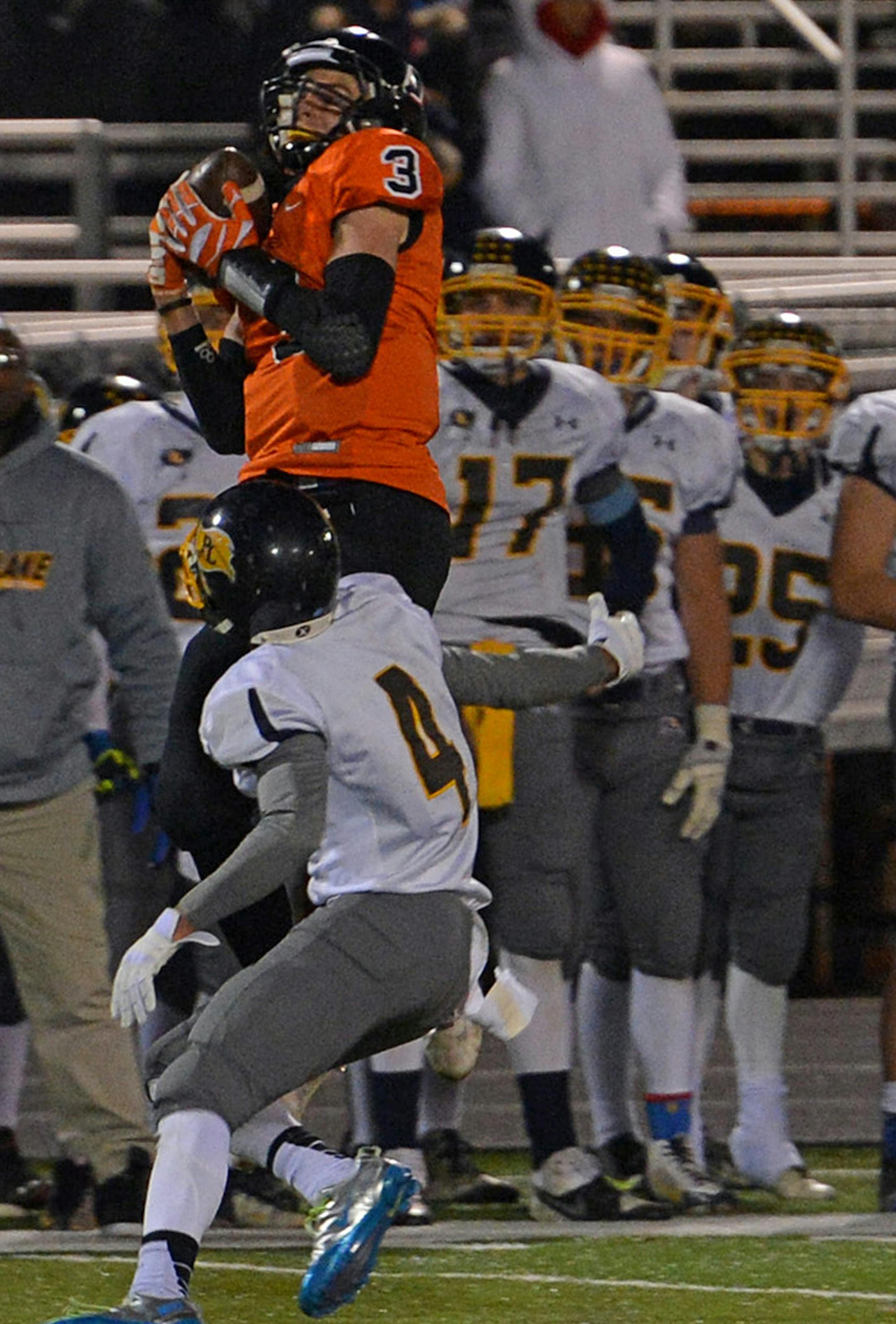 Osseo wide receiver Connor Kittelson goes up for a catch during the second half of the section 6A crossover game Friday, November 1 at Osseo High School. Osseo came out on top, beating Prior Lake 17-14. ] (SPECIAL TO THE STAR TRIBUNE/BRE McGEE) **Connor Kittelson (orange, 3)