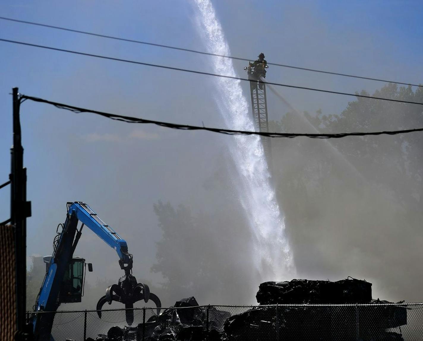 A large fire at Metro Metals Recycling sent a giant black plume of smoke skyward, visible around the metro for miles Tuesday mid-morning in St. Paul. St. Paul fire responded to the fire --mostly old cars awaiting recycling--and fairly quickly had the fire under control.