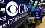 The logo for the CBS Corporation appears above a trading post on the floor of the New York Stock Exchange, Tuesday, Aug. 13, 2019. CBS and Viacom said
