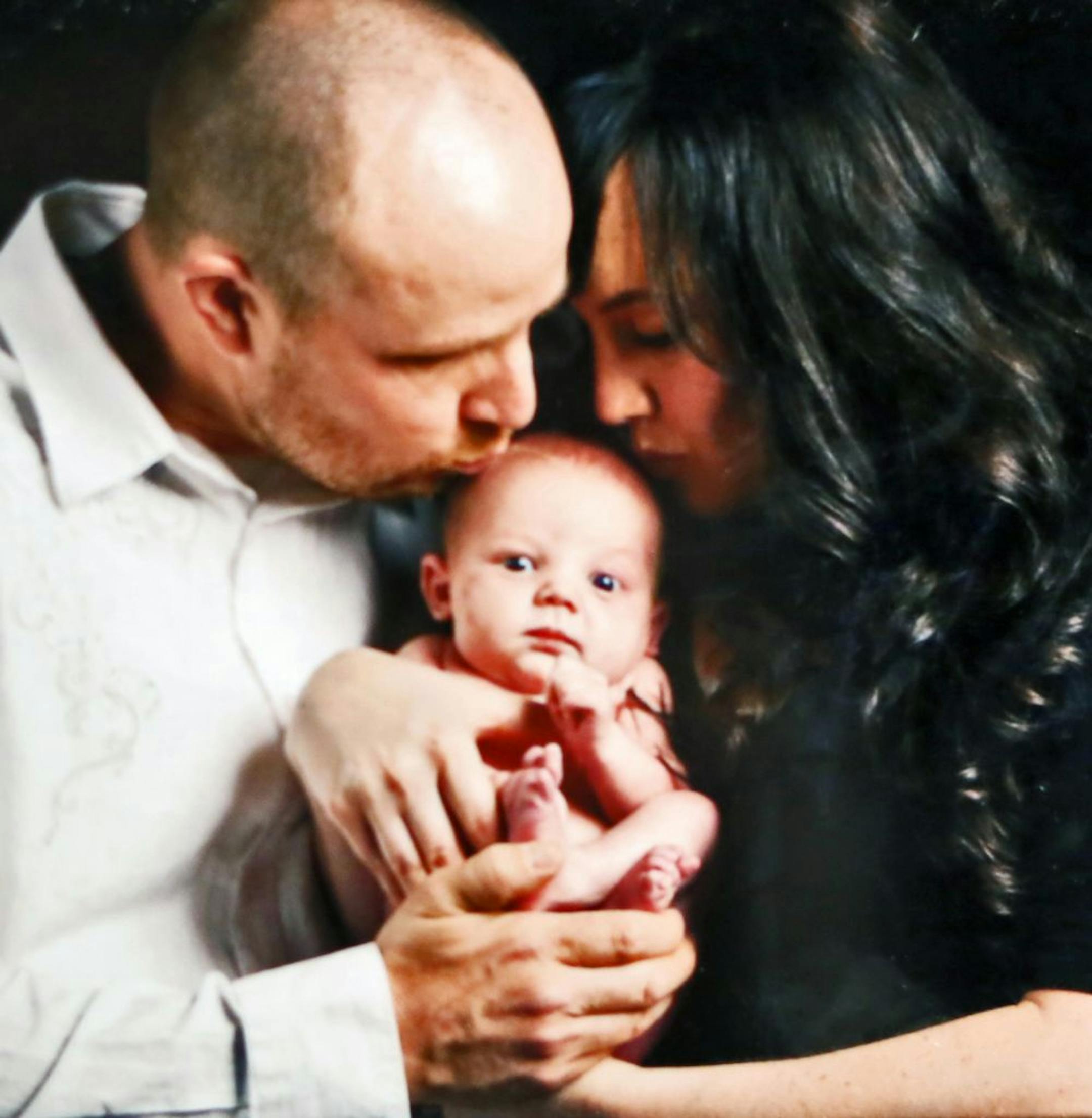 A family photo shows Mac and Stephanie Ableidinger with son Dane, who died Aug. 18, 2011.