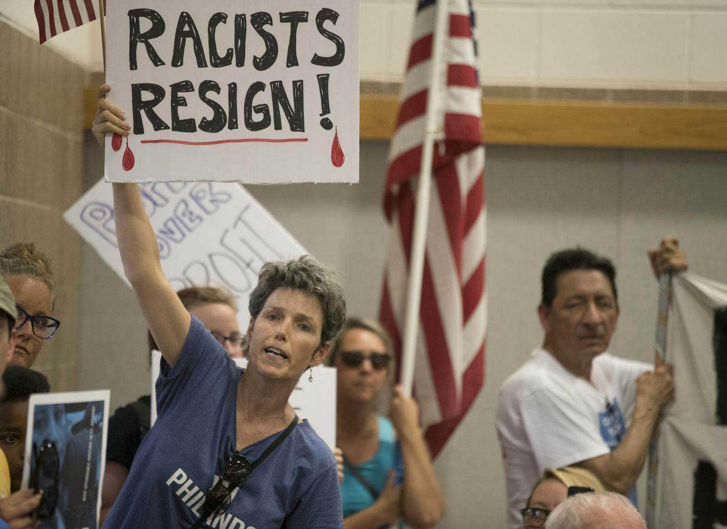 Residents of St. Anthony shouted for Mayor Jerry Faust and other council members to resign during a packed meeting . St. Anthony City Council pass a resolution to terminate its police contract with Falcon Heights at during Tuesday night's meeting at City Hall July 11, in St. Anthony, MN. ] JERRY HOLT &#xef; jerry.holt@startribune.com