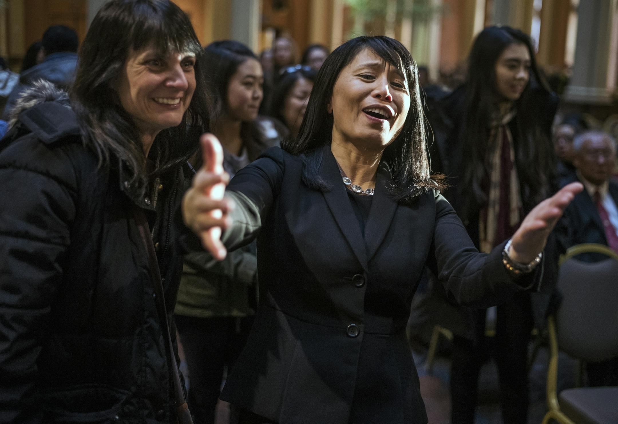 Eau Claire Memorial H.S. classmate Amber Dernbach, left brought students to the ceremony whom Sophia Vuelo hugged. Vuelo was elected president of her high school.