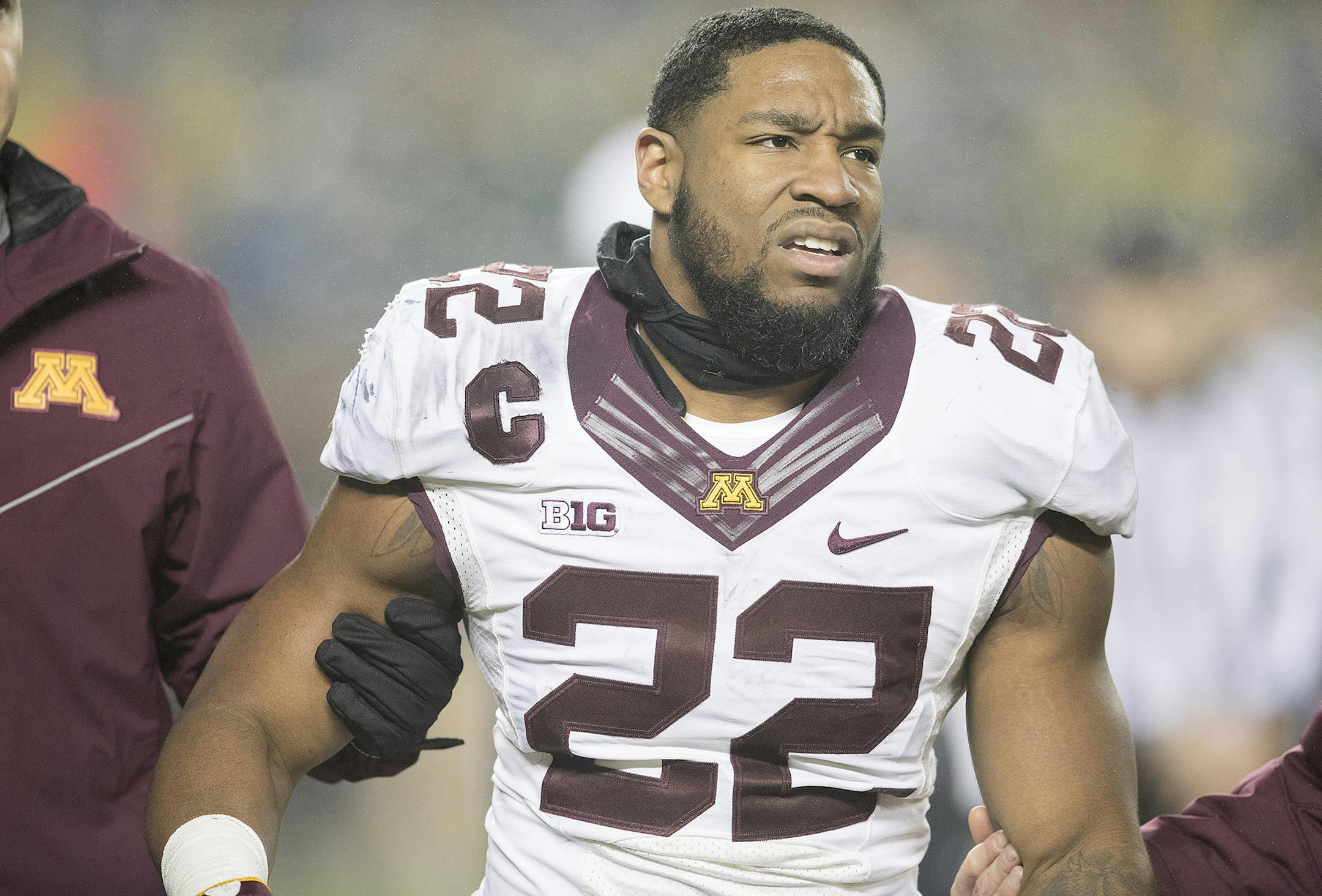 Minnesota's running back Kobe McCrary was helped off the field after being hit in the head during a return during the third quarter the Gophers took on Michigan in Michigan Stadium, Saturday, November 4, 2017 in Ann Arbor, MI. ] ELIZABETH FLORES ï liz.flores@startribune.com