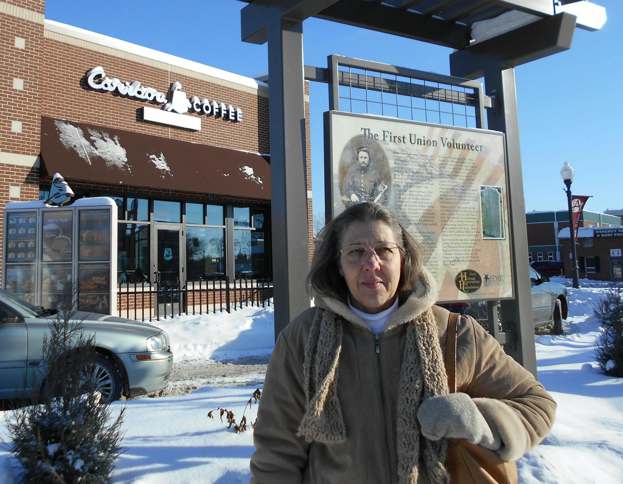 Vickie Wendel, of the Anoka County Historical Society, stood beside a historic sign noting the first Minnesotan volunteered here for the Union Army in the Civil War, at Ferry and Main St. in Anoka. Photo: Jim Adams/Star Tribune 12/10/13 Anoka, MN.