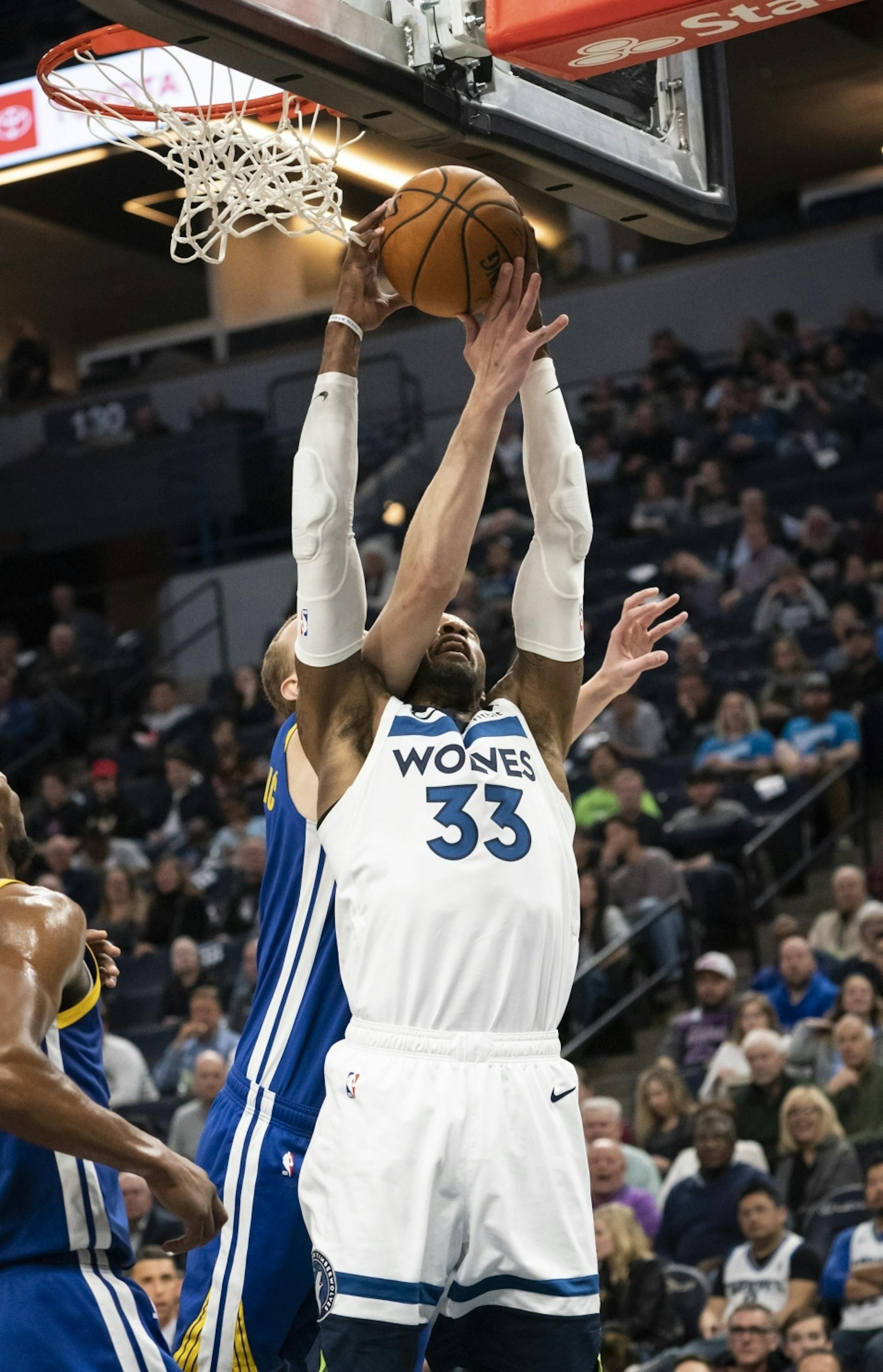 Minnesota Timberwolves forward Robert Covington (33) grabbed a rebound from Golden State Warriors forward Alen Smailagic (6) in the second half.