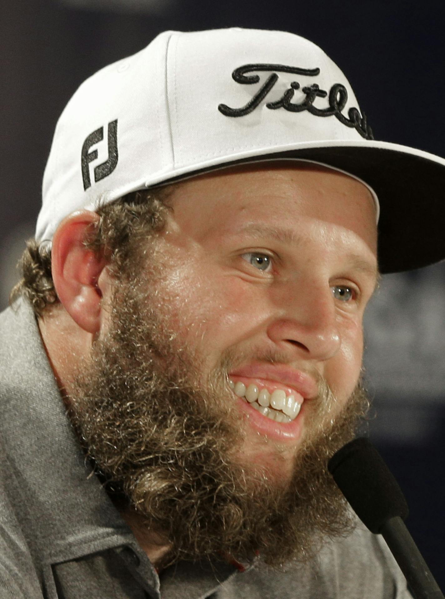 Andrew Johnston, of England, smiles as he answers a question before a practice round for the PGA Championship golf tournament at Baltusrol Golf Club in Springfield, N.J., Wednesday, July 27, 2016. (AP Photo/Chuck Burton)