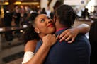 Johnika Sims gave a hug to her new husband Tre'zjaun after their wedding ceremony on Valentine's Day at the Government Center.