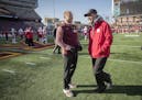 Minnesota's Head Coach P. J. Fleck, right, and Nebraska Head Coach Mike Riley greeted each other on the field before the Gophers took on Nebraska, Sat