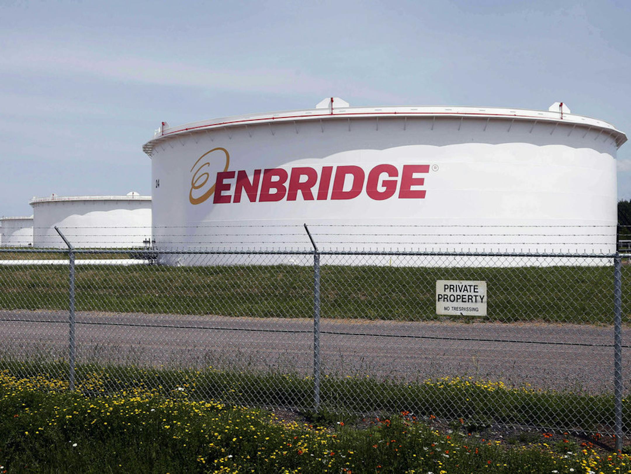 FILE - This June 29, 2018 photo shows tanks at the Enbridge Energy terminal in Superior, Wis. Enbridge Energy's plan to replace its aging Line 3 crude oil pipeline across northern Minnesota has hit another obstacle. Earlier this month a court said the project's environmental impact statement failed to address the possibility of an oil spill into the Lake Superior watershed. Now the Minnesota Pollution Control Agency and Department of Natural Resources say they can't take final action on the proj