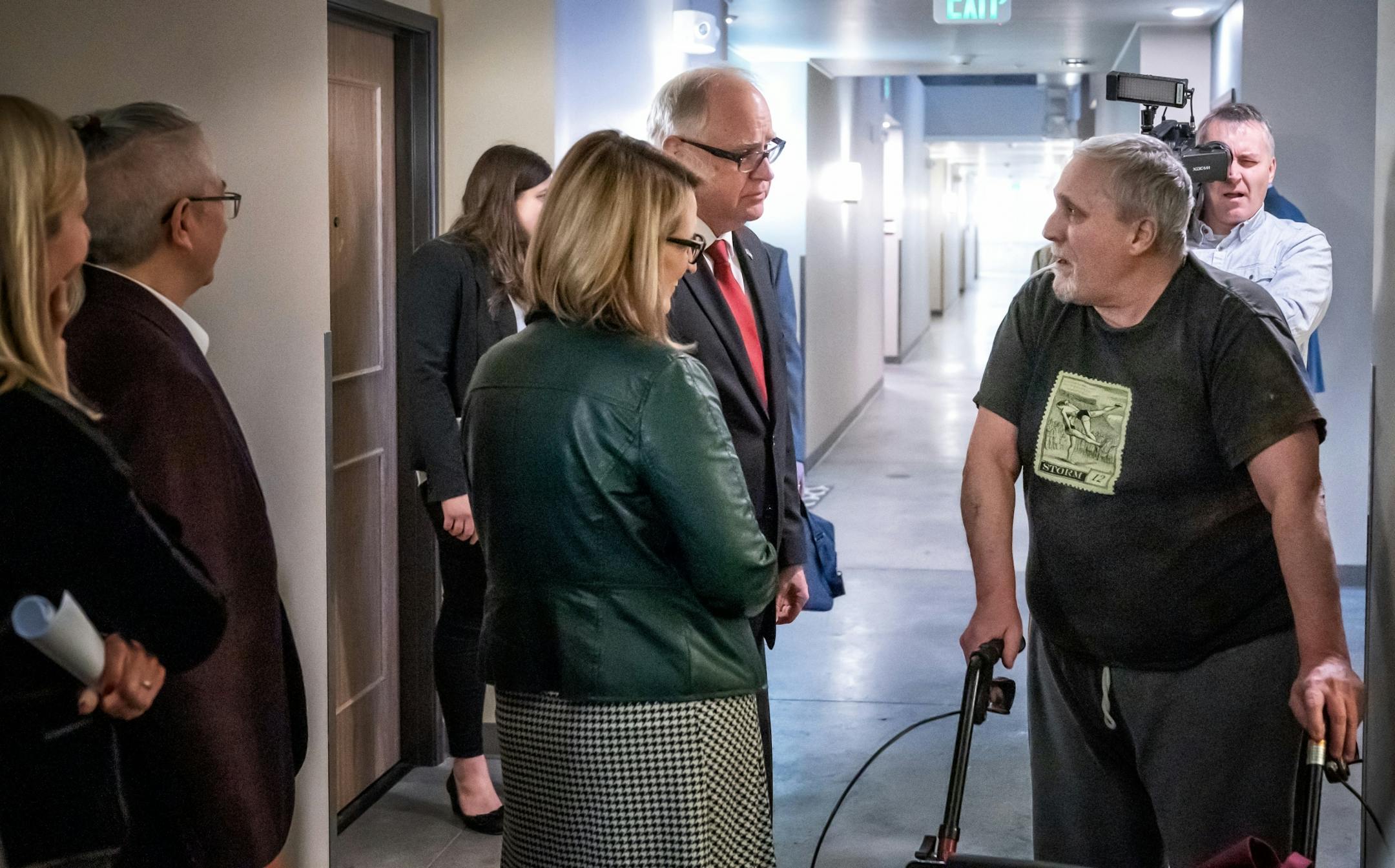 Governor Tim Walz and Lt Governor Peggy Flanagan stopped to talk with resident Ken Reson as they toured the Upper Post Veterans Community at Fort Snelling, remodeled as a place to live for formerly homeless veterans. He touted it as an example of important and appropriate investments in Minnesota as he released his $1.3 billion bonding proposal.