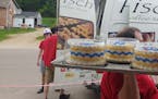 Billy Hanisch delivered personalized cakes for the high school graduates in Plum City, Wis.