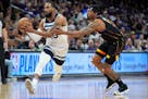 Wolves guard Mike Conley drives past Suns guard Bradley Beal in the first half Friday night, one of dozens of possessions that helped decide the outco