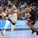 Wolves guard Mike Conley drives past Suns guard Bradley Beal in the first half Friday night, one of dozens of possessions that helped decide the outco