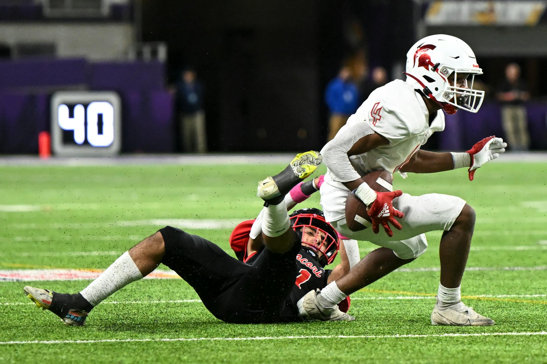 Rocori defensive back Andy Pedroza (11) falls to the turf after failing to tackle Simley wide receiver Dezmond Smith (4) who ran for a first down during the second half.