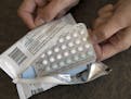 FILE - In this Aug. 26, 2016, file photo, a one-month dosage of hormonal birth control pills is displayed in Sacramento, Calif. The Trump administrati