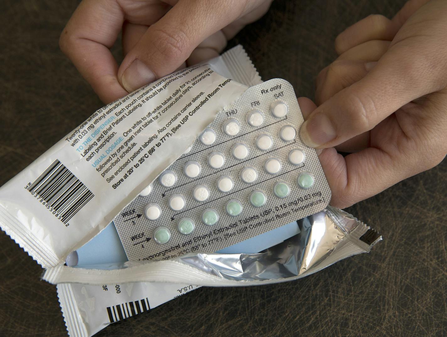 FILE - In this Aug. 26, 2016, file photo, a one-month dosage of hormonal birth control pills is displayed in Sacramento, Calif. The Trump administration&#xed;s new birth control rule is raising questions among some doctors and researchers. They say it overlooks known benefits of contraception while selectively citing data that raise doubts about effectiveness and safety. Recently issued rules allow more employers to opt out of covering birth control as a preventive benefit for women under former