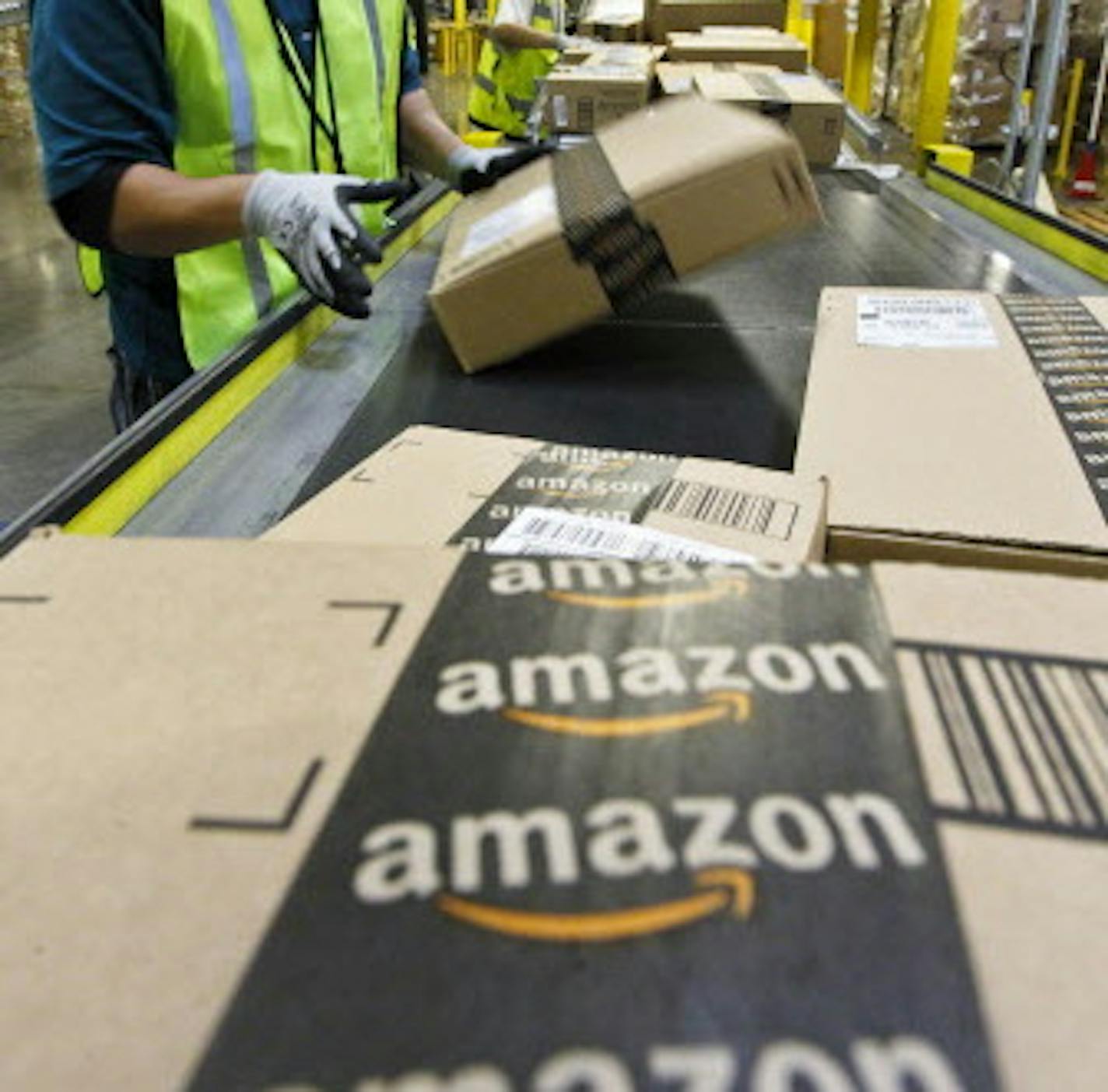 On "Cyber Monday" Nicholas Lerma gets packages ready for shipping at the Amazon.com 1.2 million square foot fulfillment center Monday, Nov. 26, 2012, in Phoenix. Americans clicked away on their computers and smartphones for deals on Cyber Monday, which is expected to be the biggest online shopping day in history. Shoppers are expected to spend $1.5 billion on Cyber Monday, up 20 percent from last year, according to research firm comScore. That would not only make it the biggest online shopping d