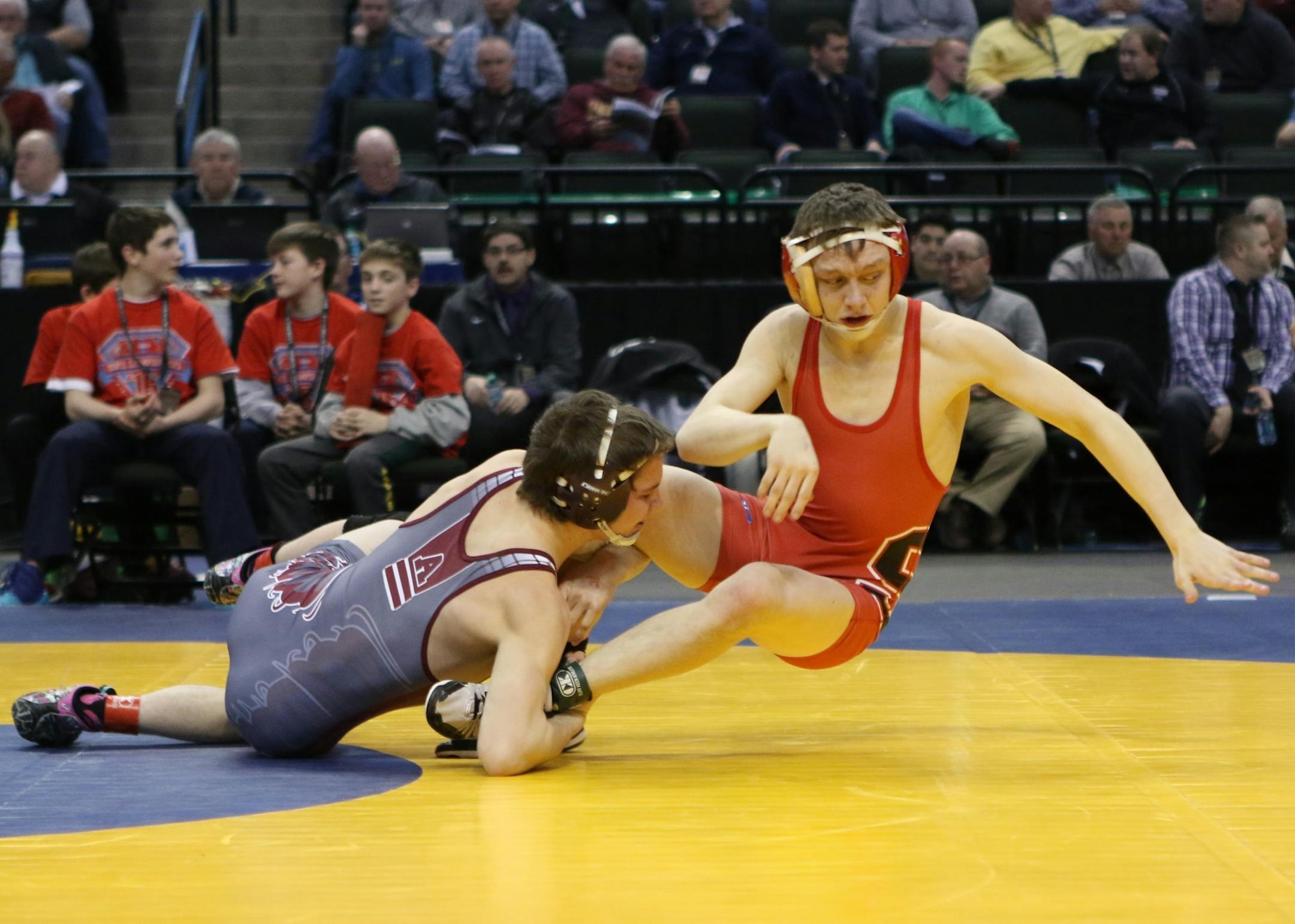 Brent Jones, right, of Shakopee and Tyler Eischens of Anoka wrestled in the championship match of the 126-pound class on Feb. 27 at the wrestling state meet at Xcel Energy Center in St. Paul. Jones won the match to claim his third individual title in three years.