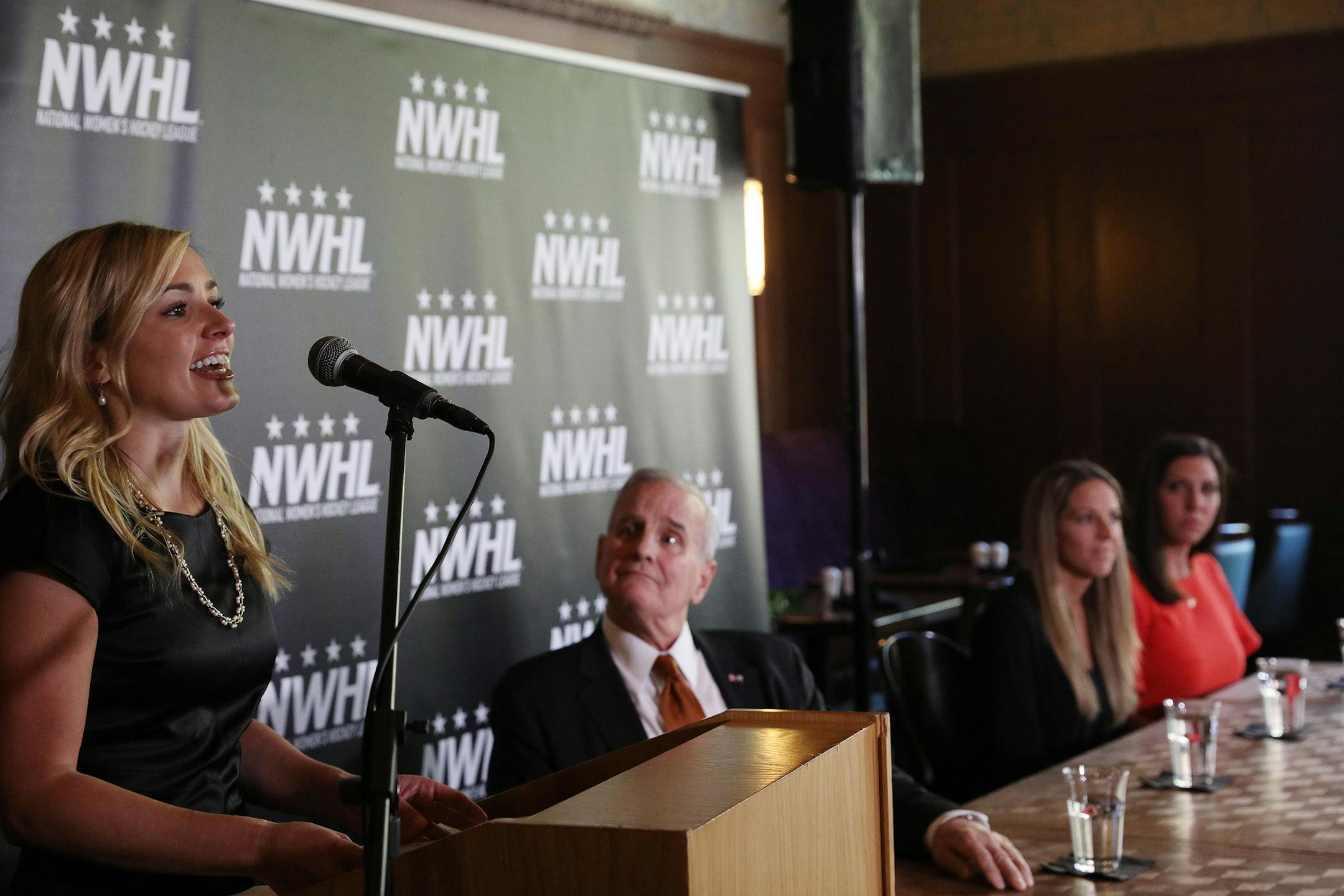 National Women's Hockey League founder and commissioner Dani Rylan, left, spoke as Gov. Mark Dayton looked on during Tuesday's announcement. ] ANTHONY SOUFFLE ï anthony.souffle@startribune.com Officials with the National Women's Hockey League held a press conference to announce they had acquired the Minnesota Whitecaps Tuesday, May 15, 2018 at Herbie's on the Park in St. Paul, Minn.
