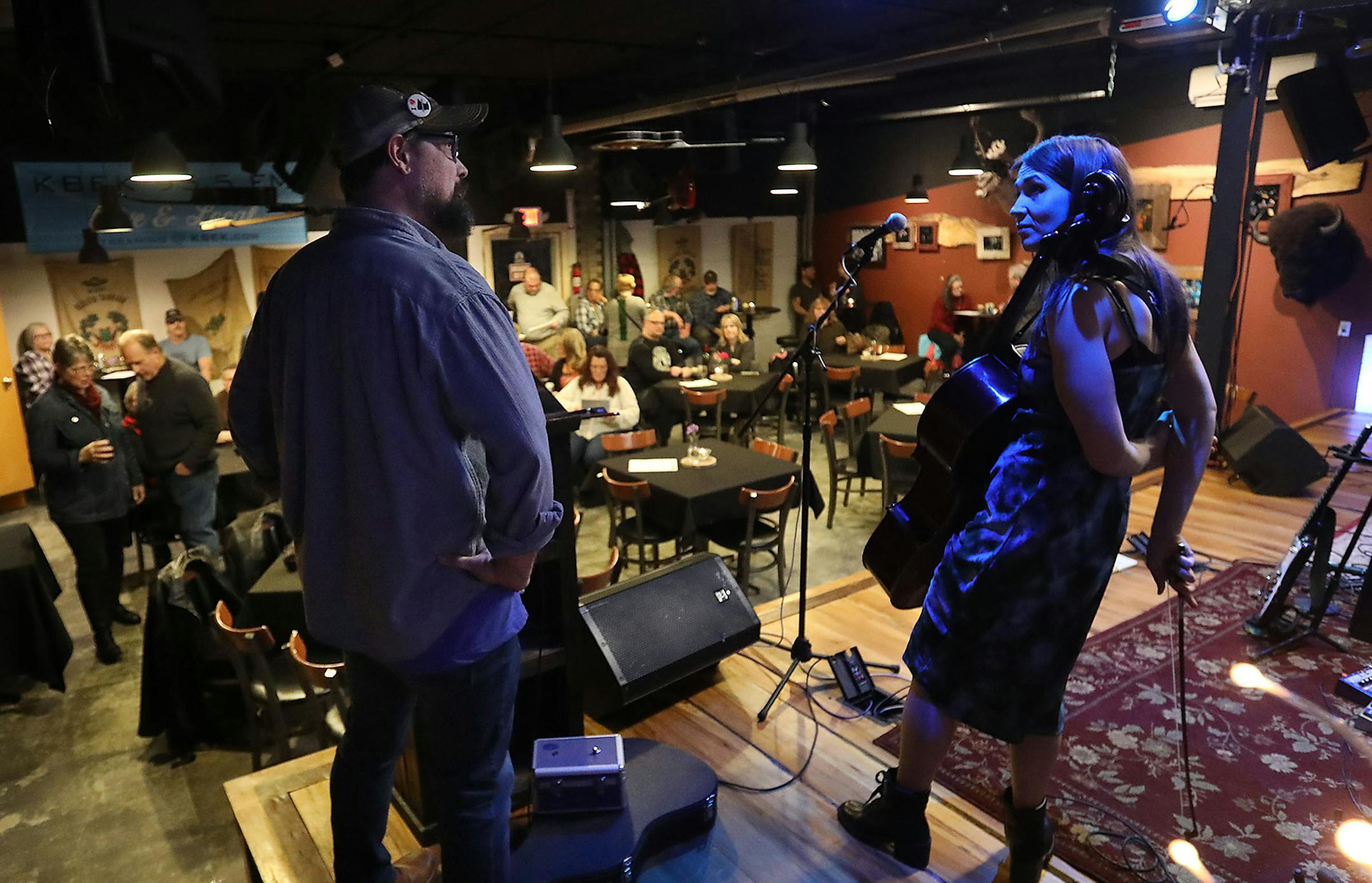 Tickets to KBEK's Friday night live shows are the toughest ticket in Kanabec County where Red Eye Ruby brought out the locals and music lovers from elsewhere Friday, Jan. 31, 2020, in Braham, MN. Here, Shawn Sullivan, left, one of the radio station's owners and KBEK DJ, chatted with Red Eye Ruby cellist Caitlin Pieper during the sound check in The Listening Room at KBEK, which was close to full during the sound check in this town of less than 2,000.] DAVID JOLES • david.joles@startribune.