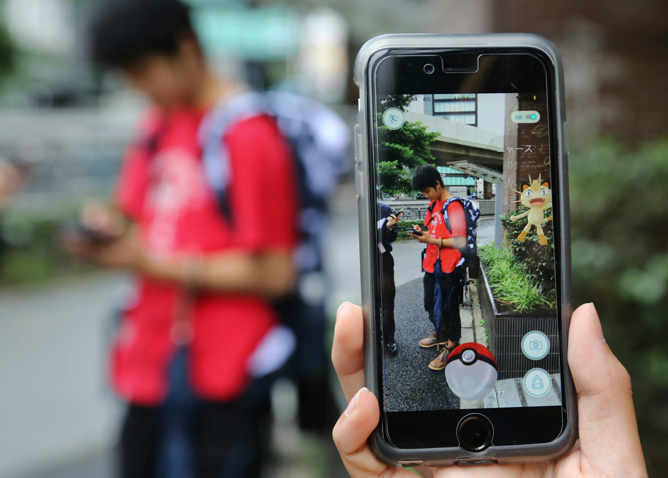 Students played Pokemon Go in the streets in July.