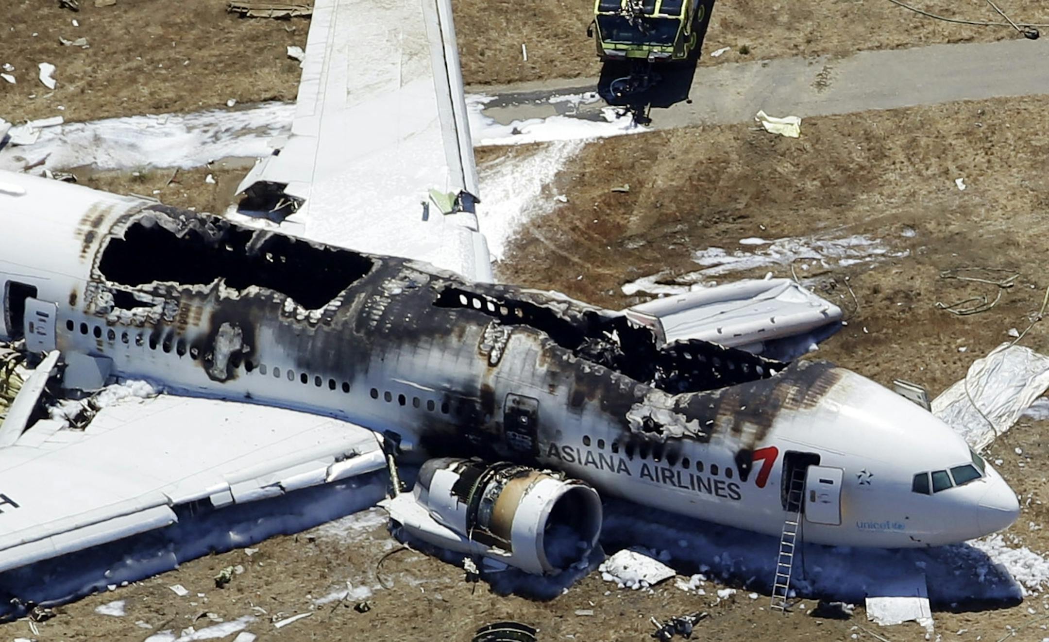 This aerial photo shows the wreckage of the Asiana Flight 214 airplane after it crashed at the San Francisco International Airport in San Francisco, Saturday, July 6, 2013. (AP Photo/Marcio Jose Sanchez)