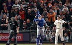 Drama makes playoff baseball more fun. Thursday night, the Giants’ Wilmer Flores, right, reacted after he was called out on strikes as Dodgers catch