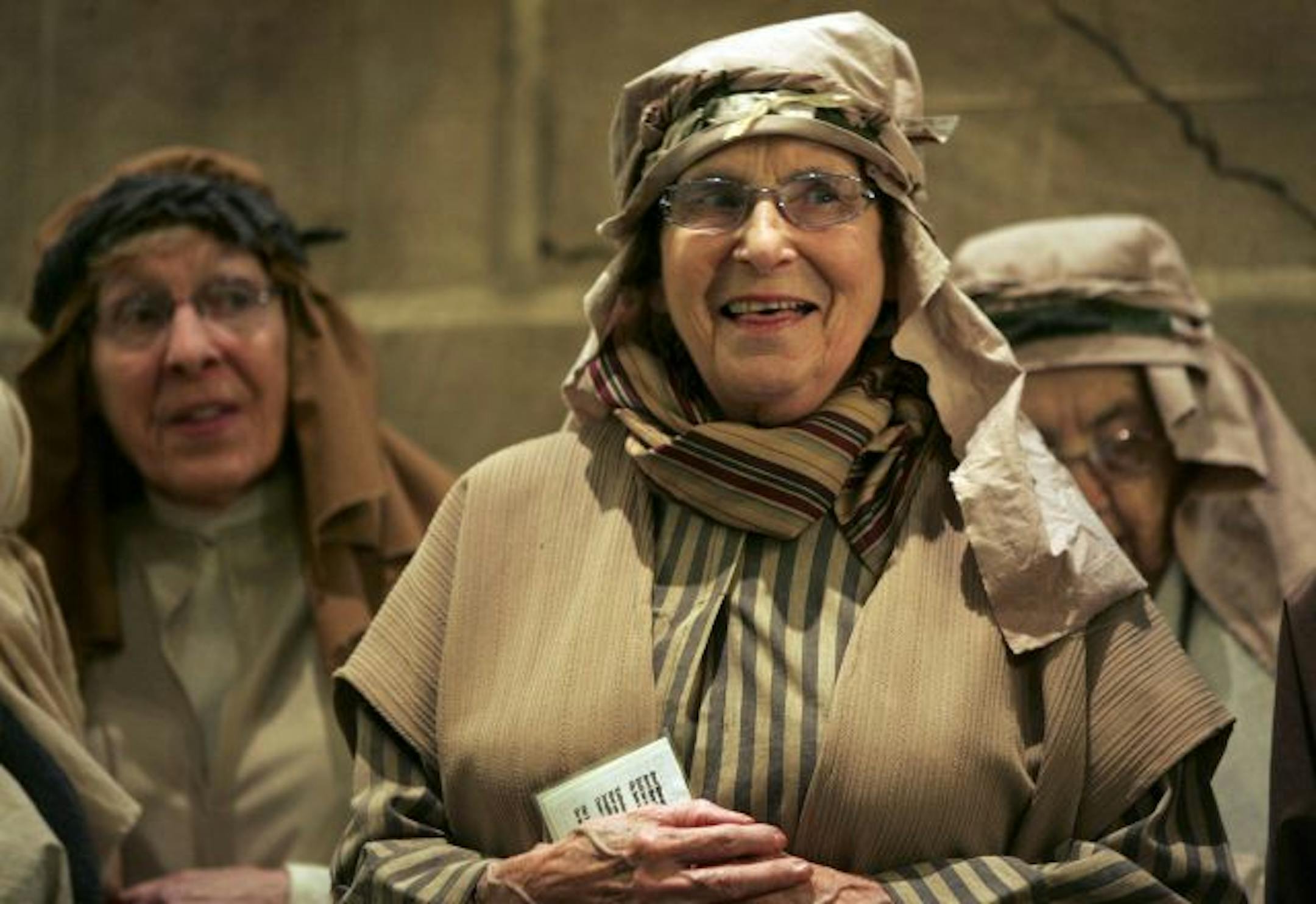 Irene Gardner, center, and Alice Fink, left, dressed as shepherds and sang in the chorus during a rehearsal at St. Peter's Church.