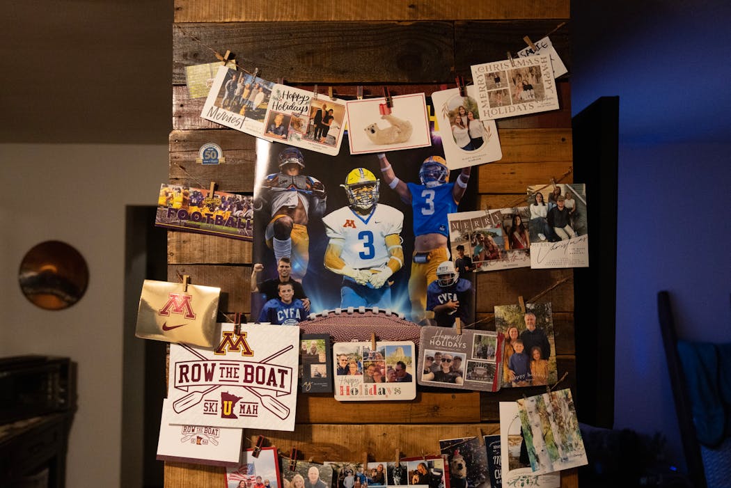 A collage of Koi Perich’s football career hung on the wall surrounded by holiday cards on Jan. 11 at his family’s home in Esko, Minn.
