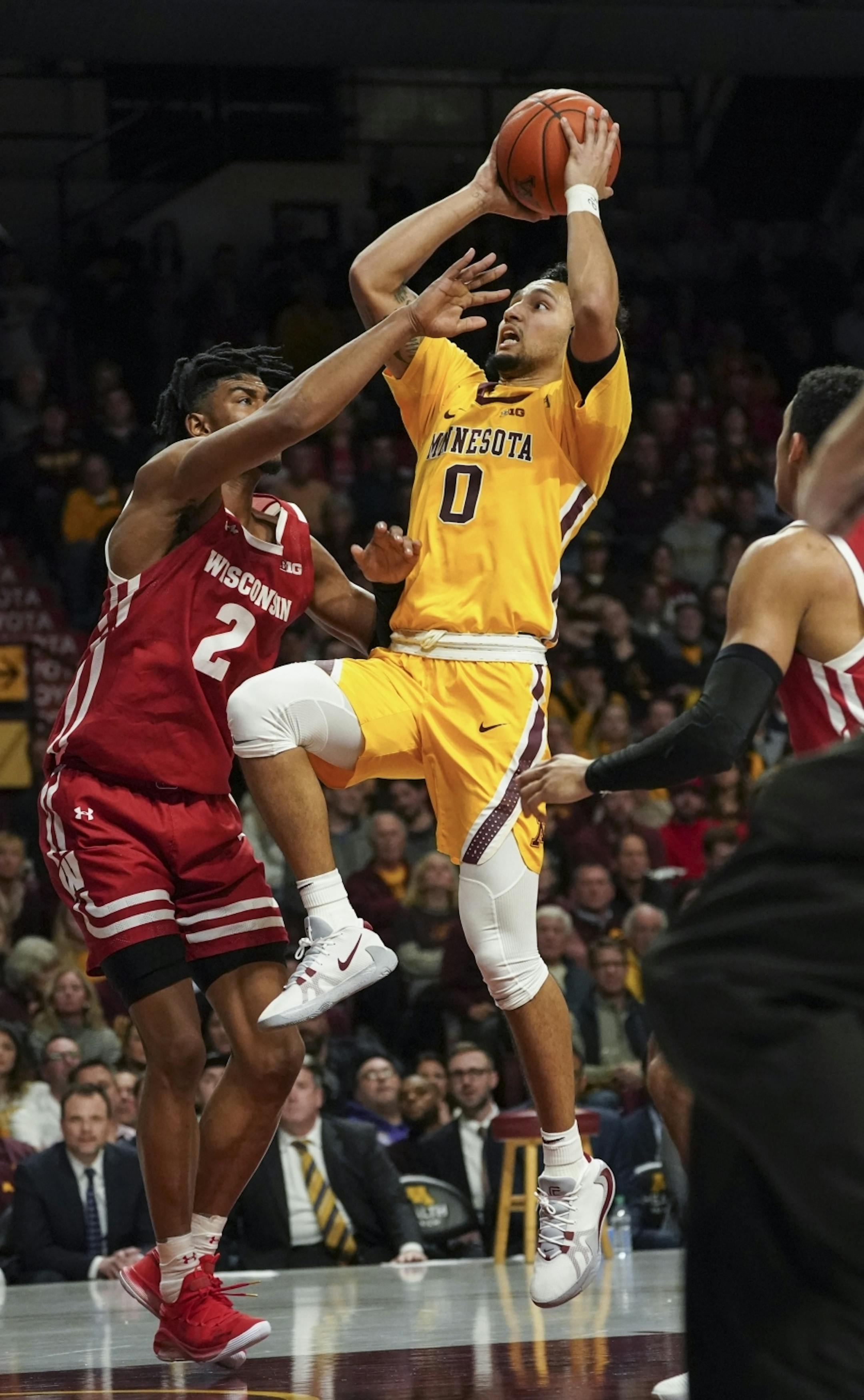 Minnesota Gophers guard Payton Willis (0) attempted a shot against Wisconsin Badgers forward Aleem Ford (2) in the second half.