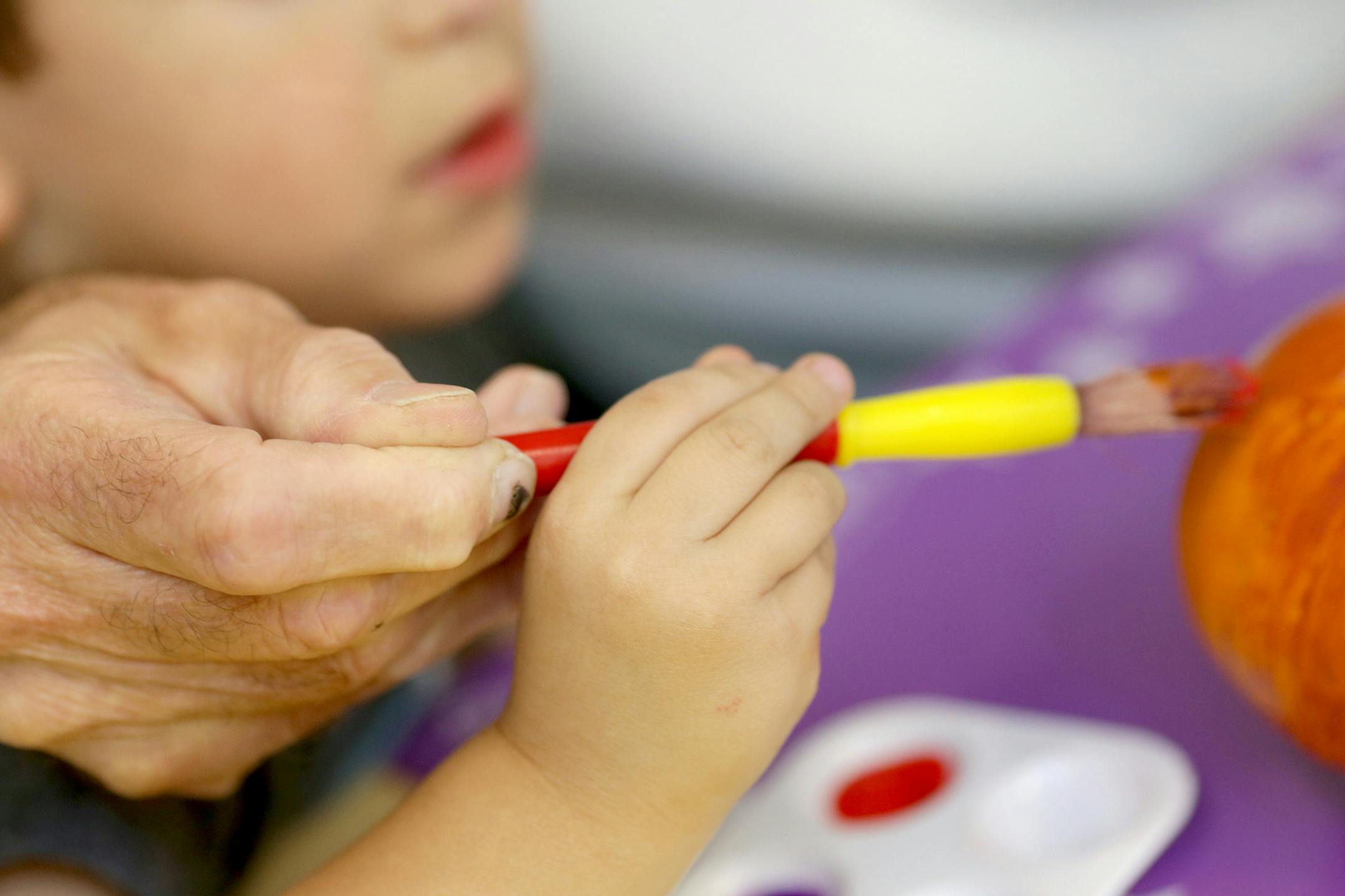Hayden Meyers, 4, and Edward Wheat decorate a tiny pumpkin during an activity at Hearts & Minds Activity Center in San Jose, Calif., on Thursday, Oct. 24, 2019. (Anda Chu/Bay Area News Group/TNS) ORG XMIT: 1513654
