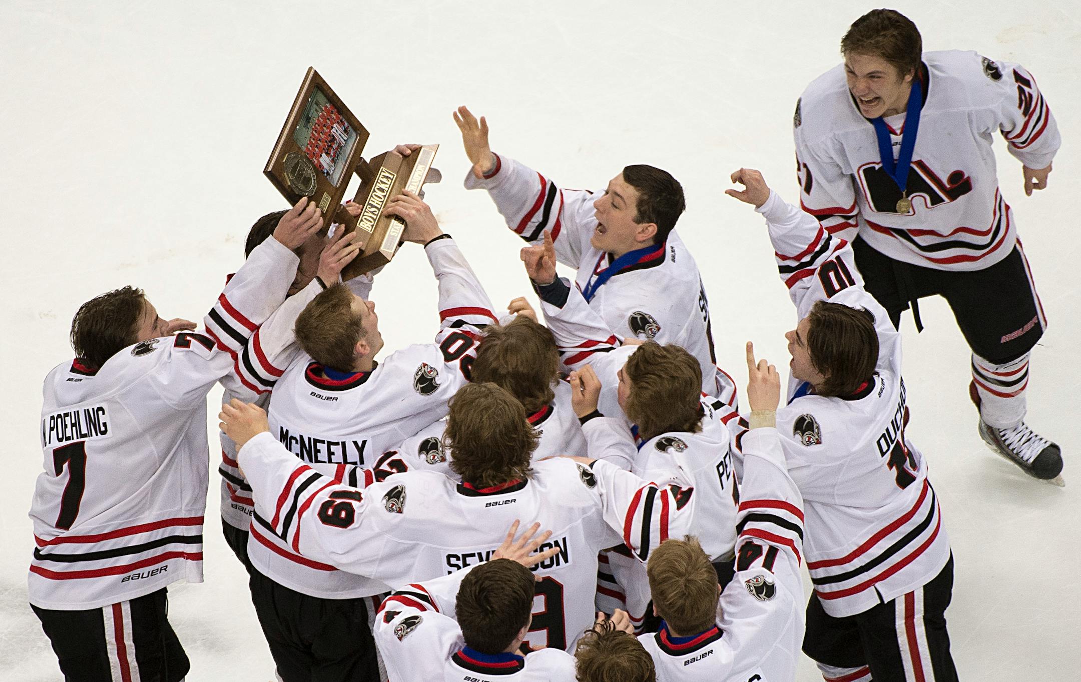 Lakeville North players hoisted their championship trophy after beating Duluth East in the Class 2A boys' hockey title game in March.