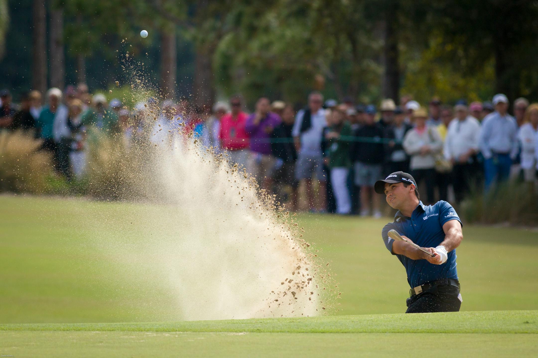 PGA Tour player Jason Day hits from a sand trap to the ninth green during the second round of the Franklin Templeton Shootout on Friday, Dec. 12, 2014, at the Tiburon Golf Club in Naples, Fla. Day and his teammate, Cameron Tringale, finished in the lead of the second round of the tournament with a 3-shot lead, 25-under-par. (AP Photo/Naples Daily News, David Albers)